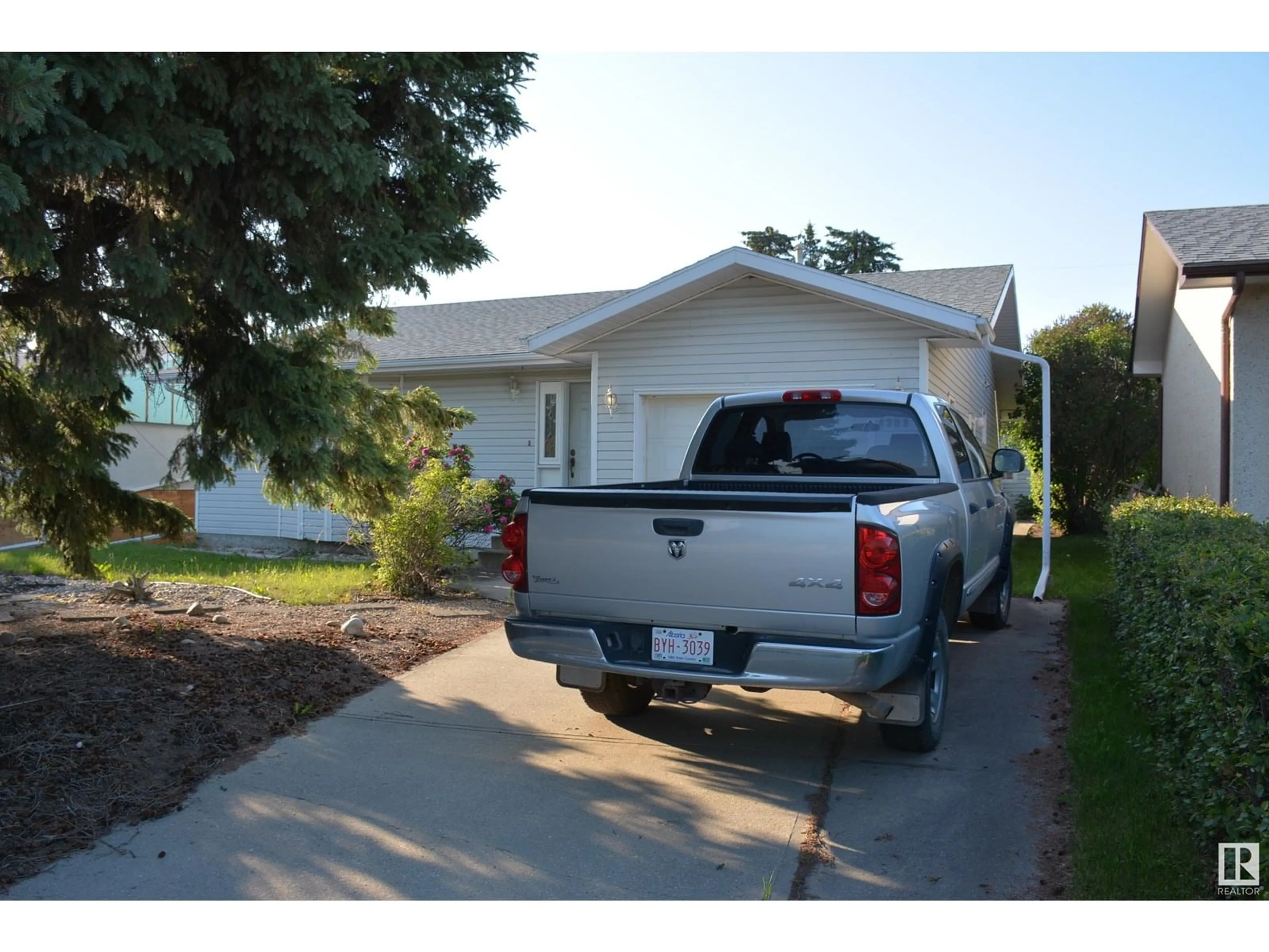 Home with vinyl exterior material, street for 4308 54 AV, Barrhead Alberta T7N1J9