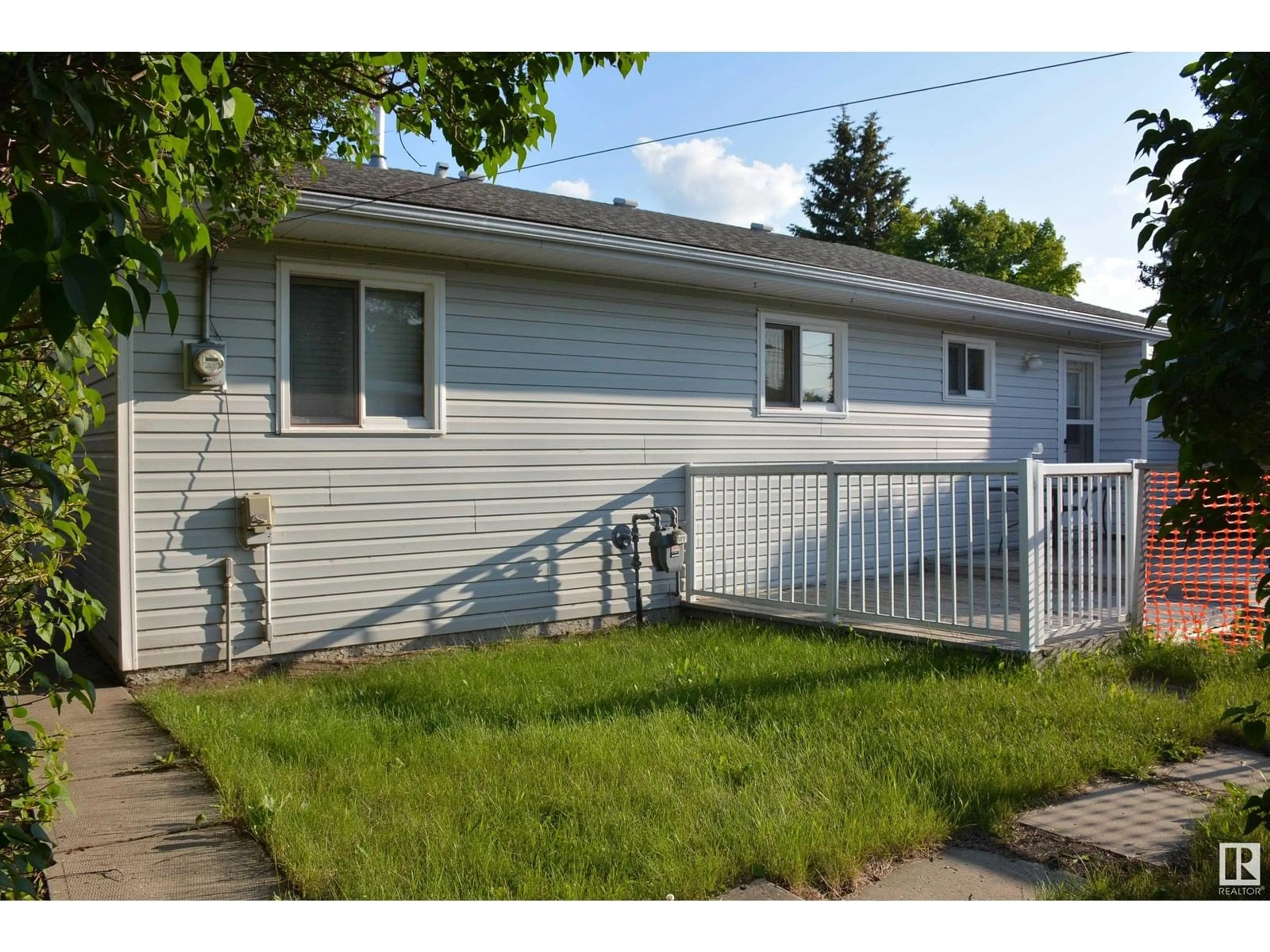 Home with vinyl exterior material, street for 4308 54 AV, Barrhead Alberta T7N1J9