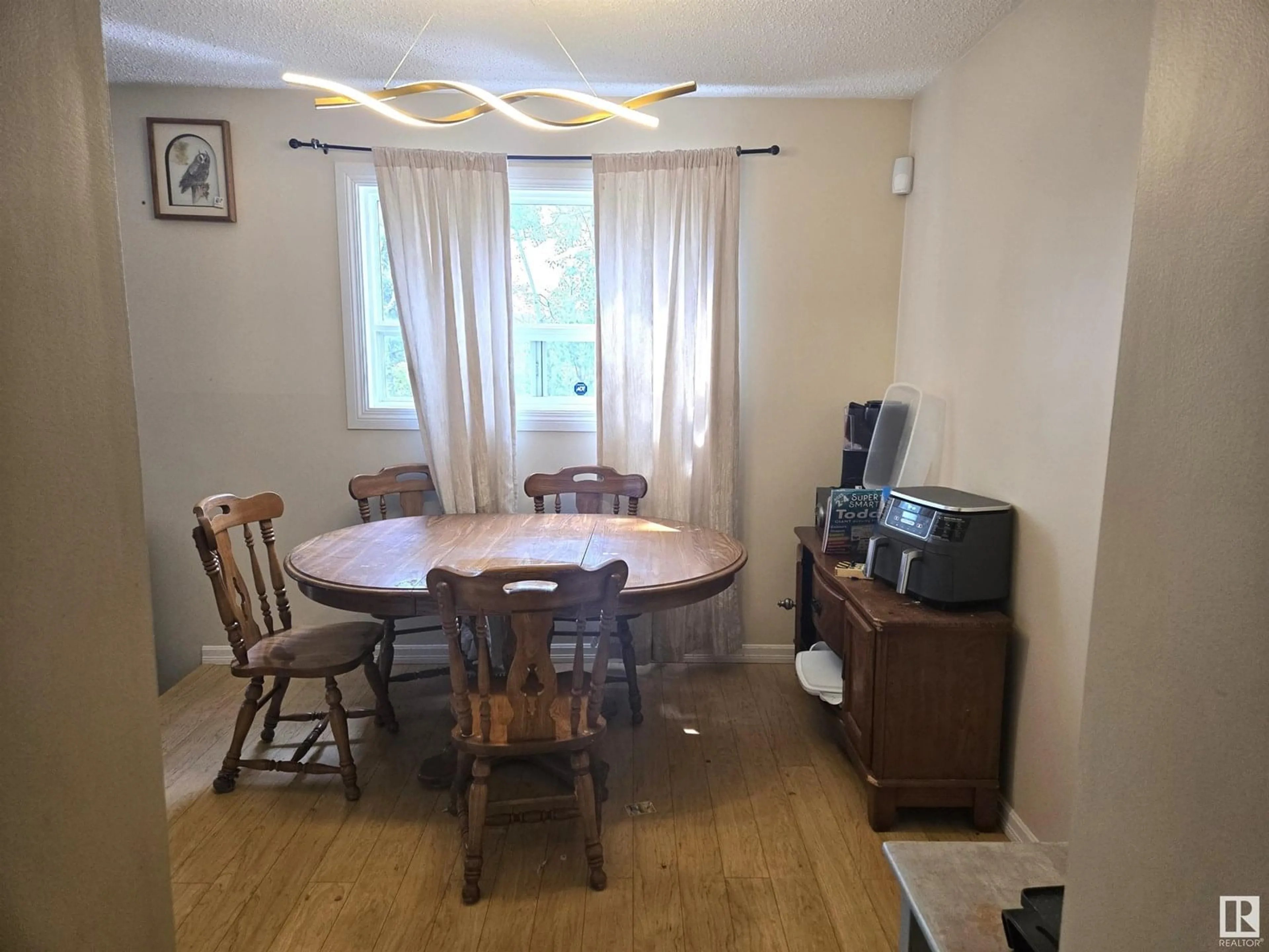 Dining room, wood/laminate floor for 2967 130 AV, Edmonton Alberta T5A3M1