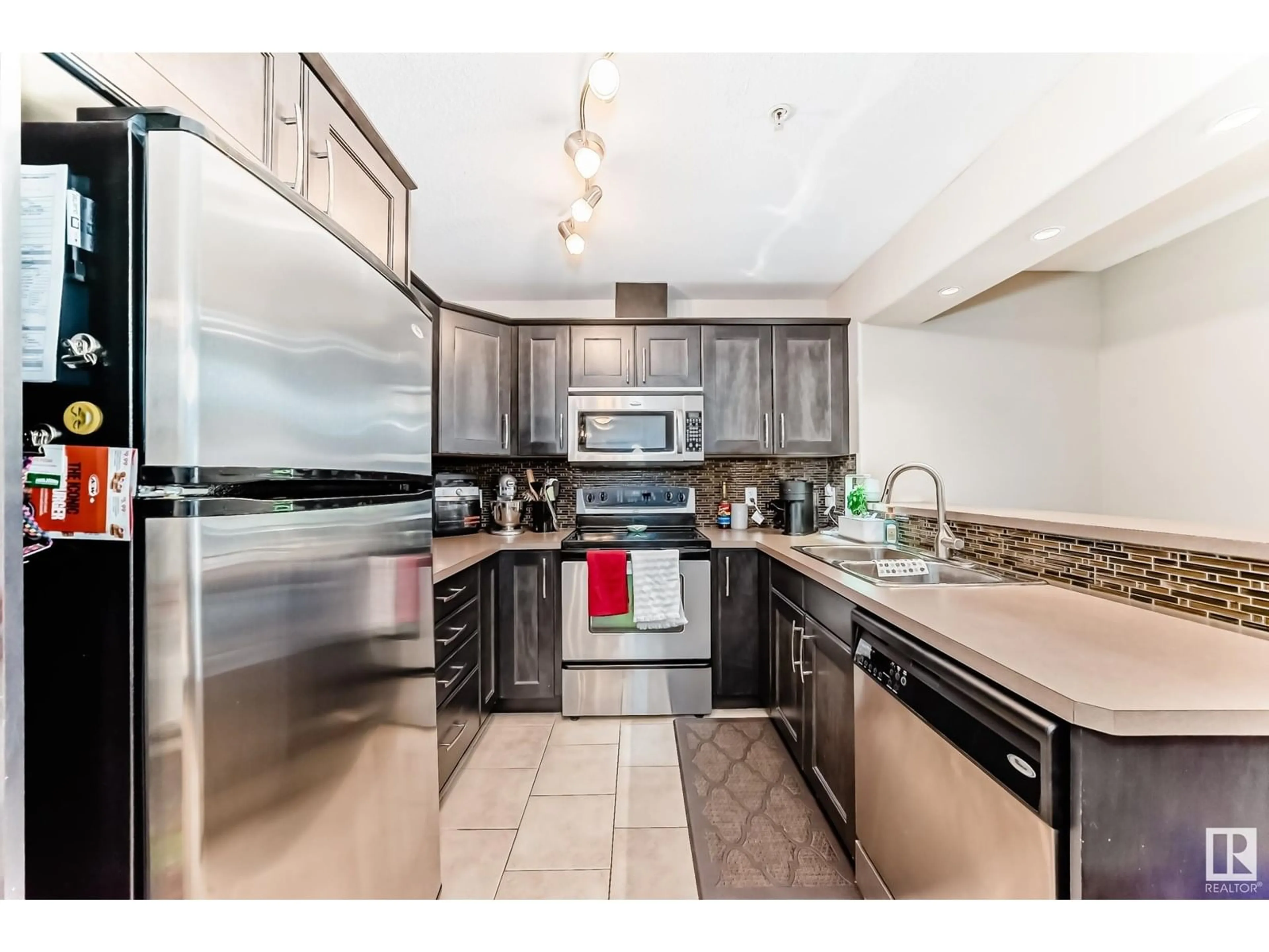 Open concept kitchen, ceramic/tile floor for #106 - 11615 ELLERSLIE RD, Edmonton Alberta T6W0J3