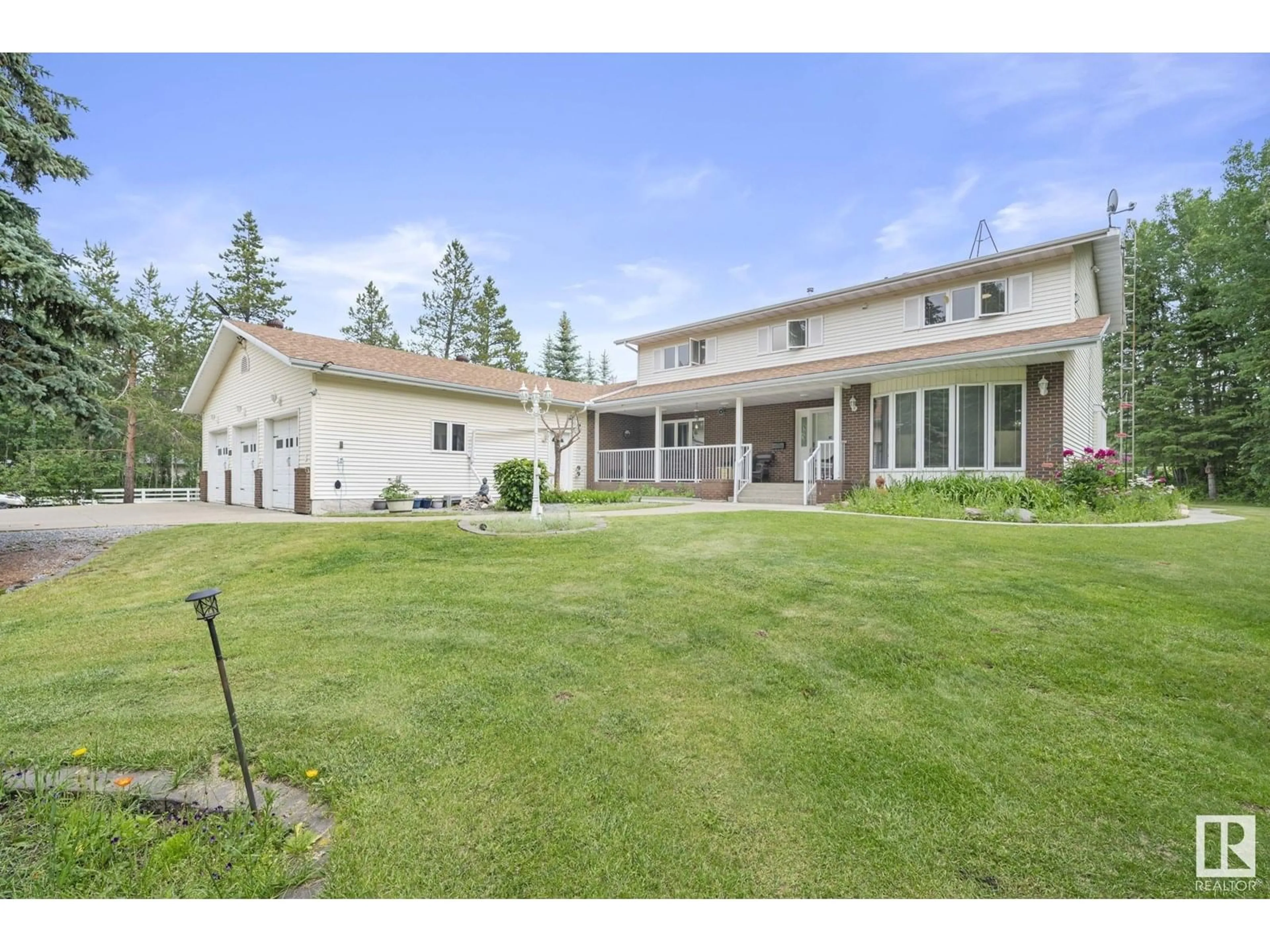 A pic from outside/outdoor area/front of a property/back of a property/a pic from drone, mountain view for 458 23109 TOWNSHIP ROAD 514, Rural Strathcona County Alberta T8B1K9