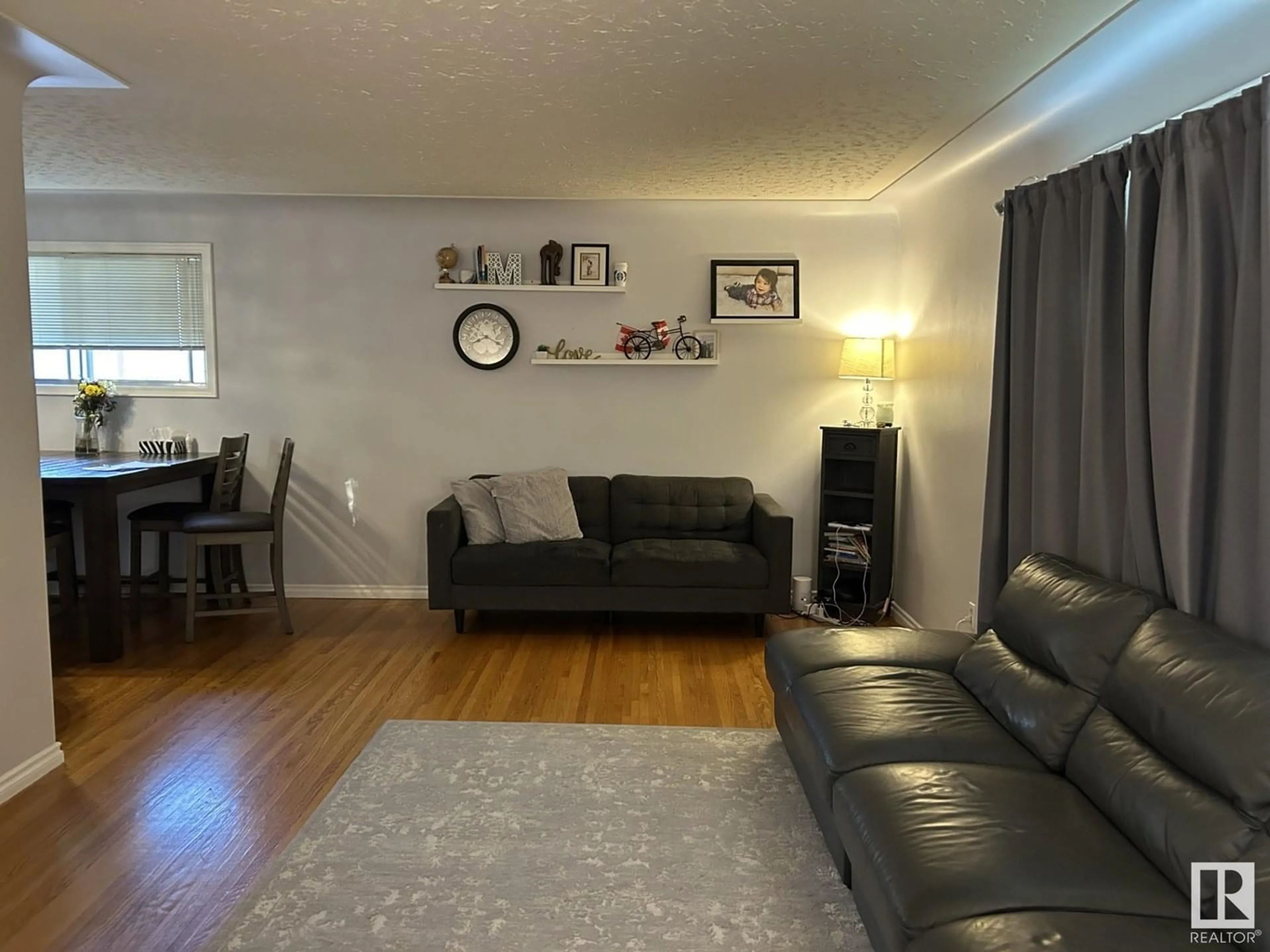 Living room with furniture, wood/laminate floor for 12247 DOVERCOURT CR, Edmonton Alberta T5L4E4