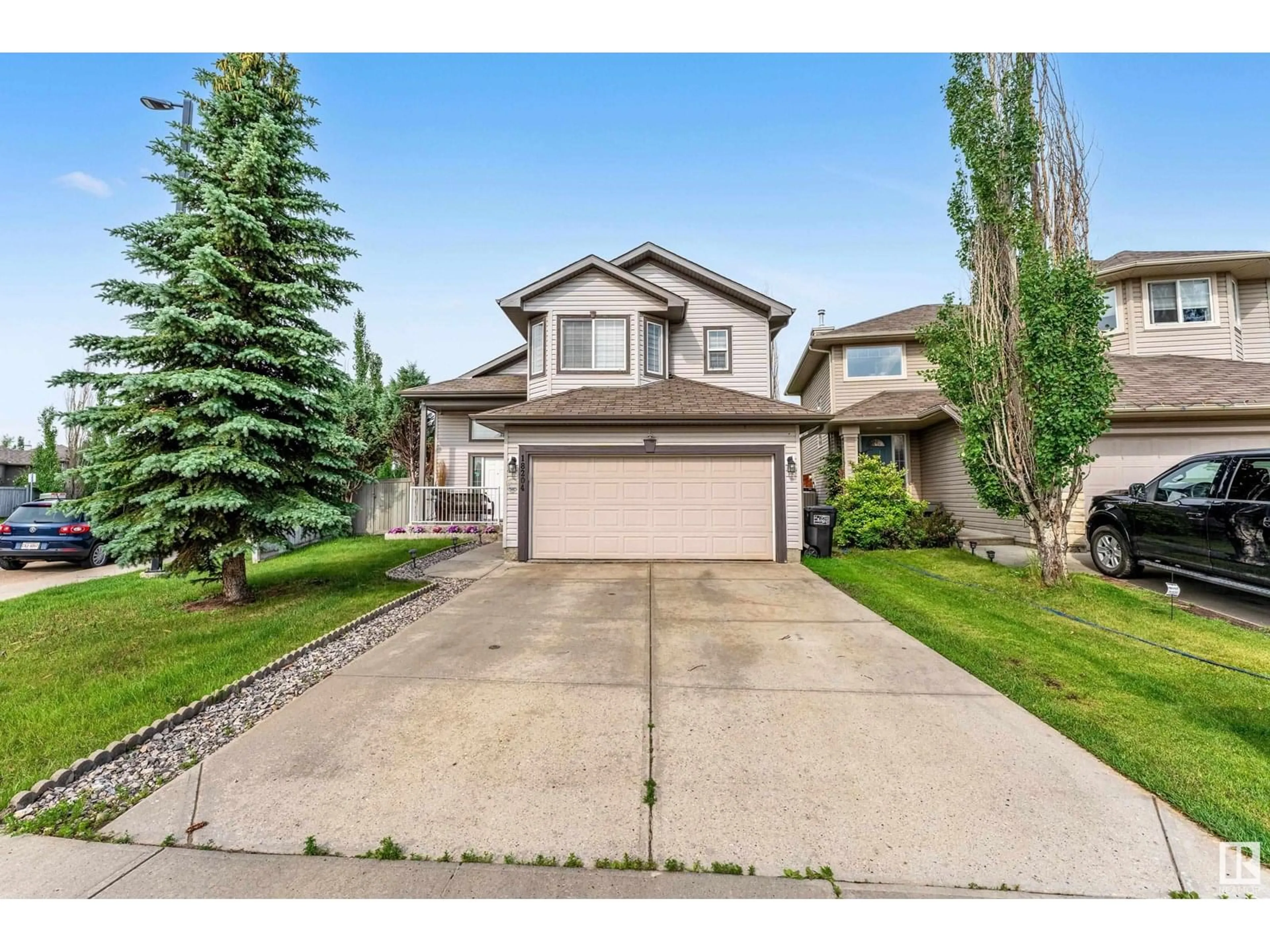 Home with vinyl exterior material, street for 18204 107 ST, Edmonton Alberta T5X6G4