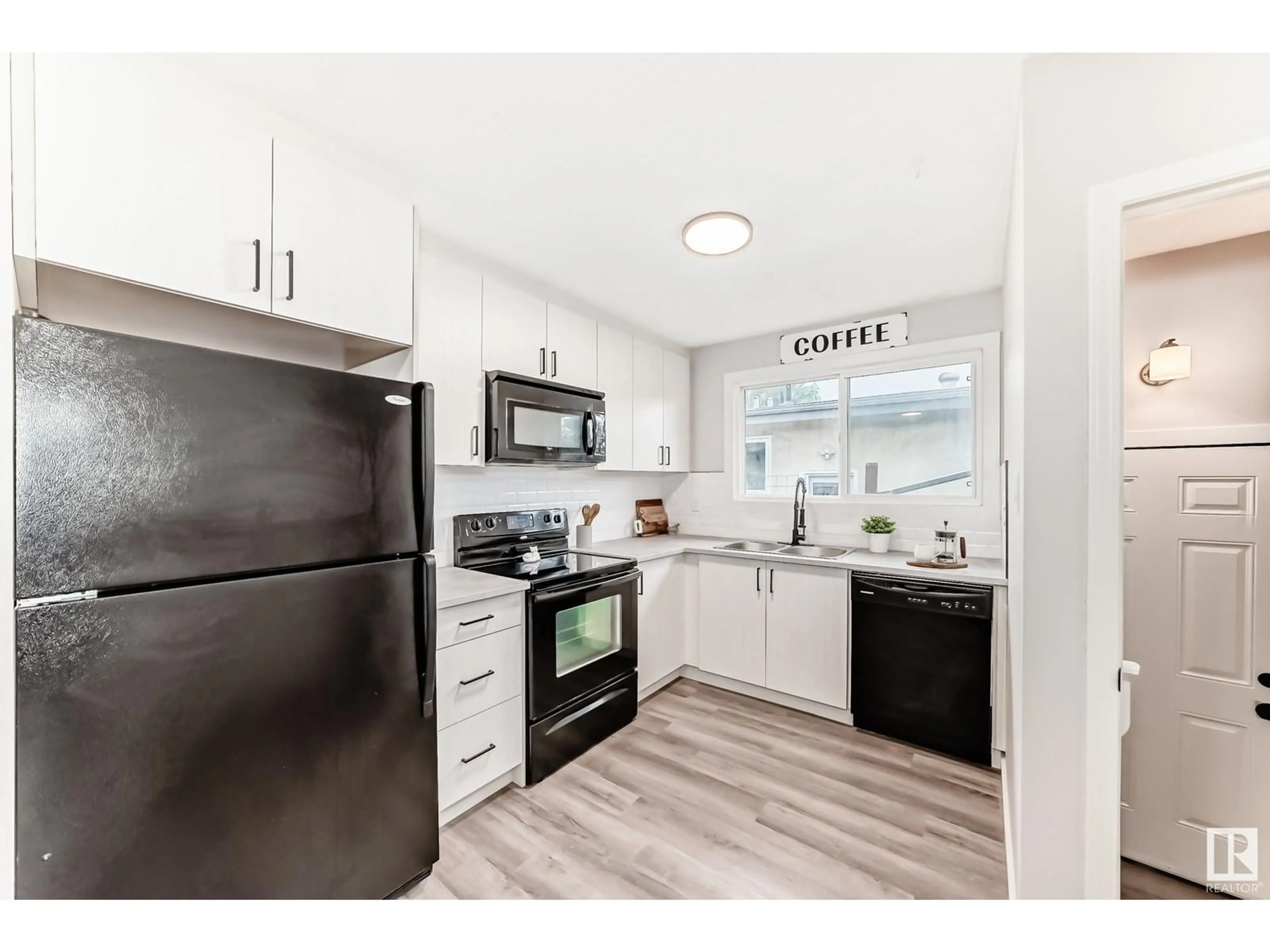 Open concept kitchen, unknown for 8405 134 AV, Edmonton Alberta T5E1G4