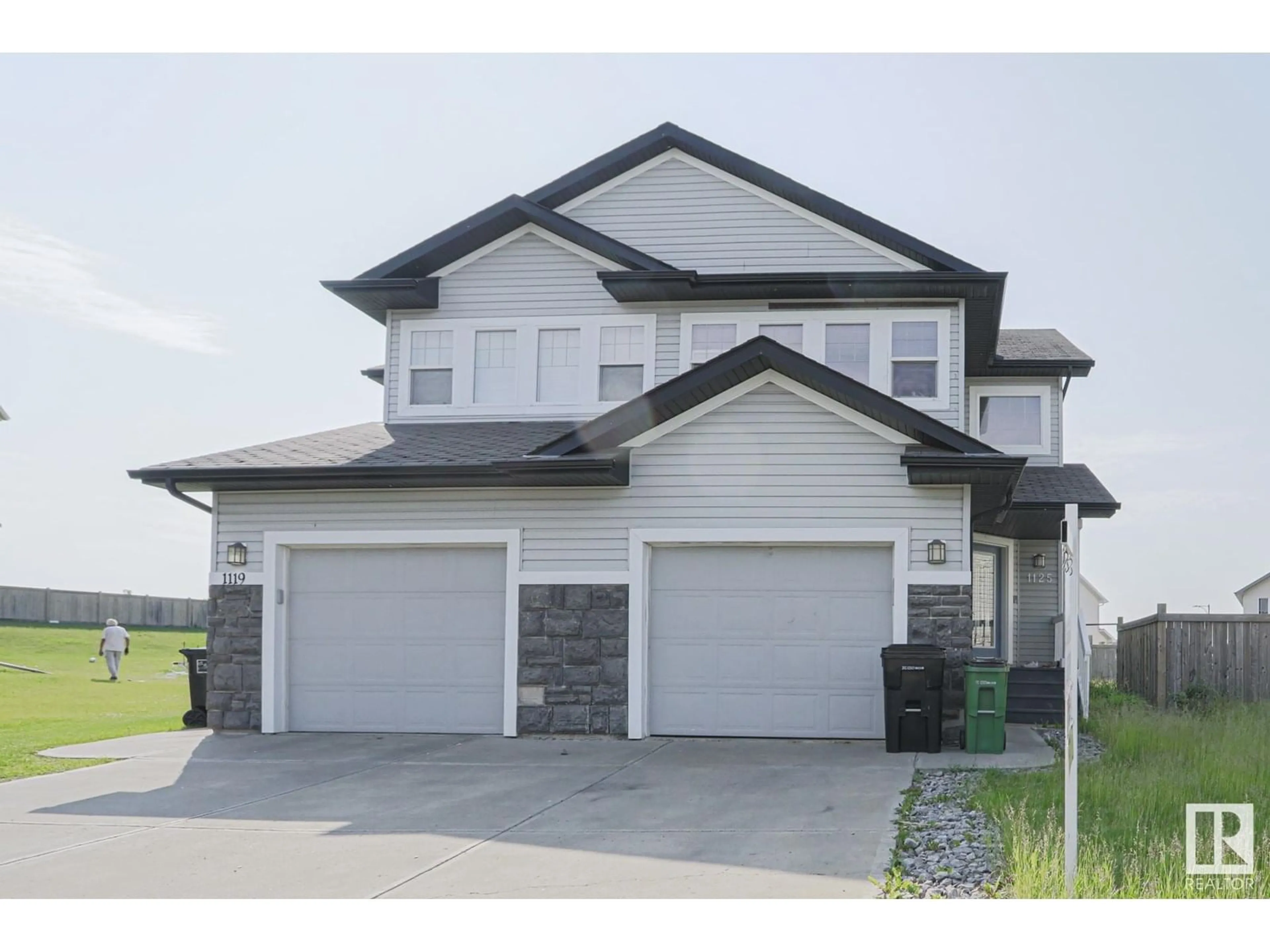 Home with vinyl exterior material, street for NW - 1125 37B AV, Edmonton Alberta T6T0E6