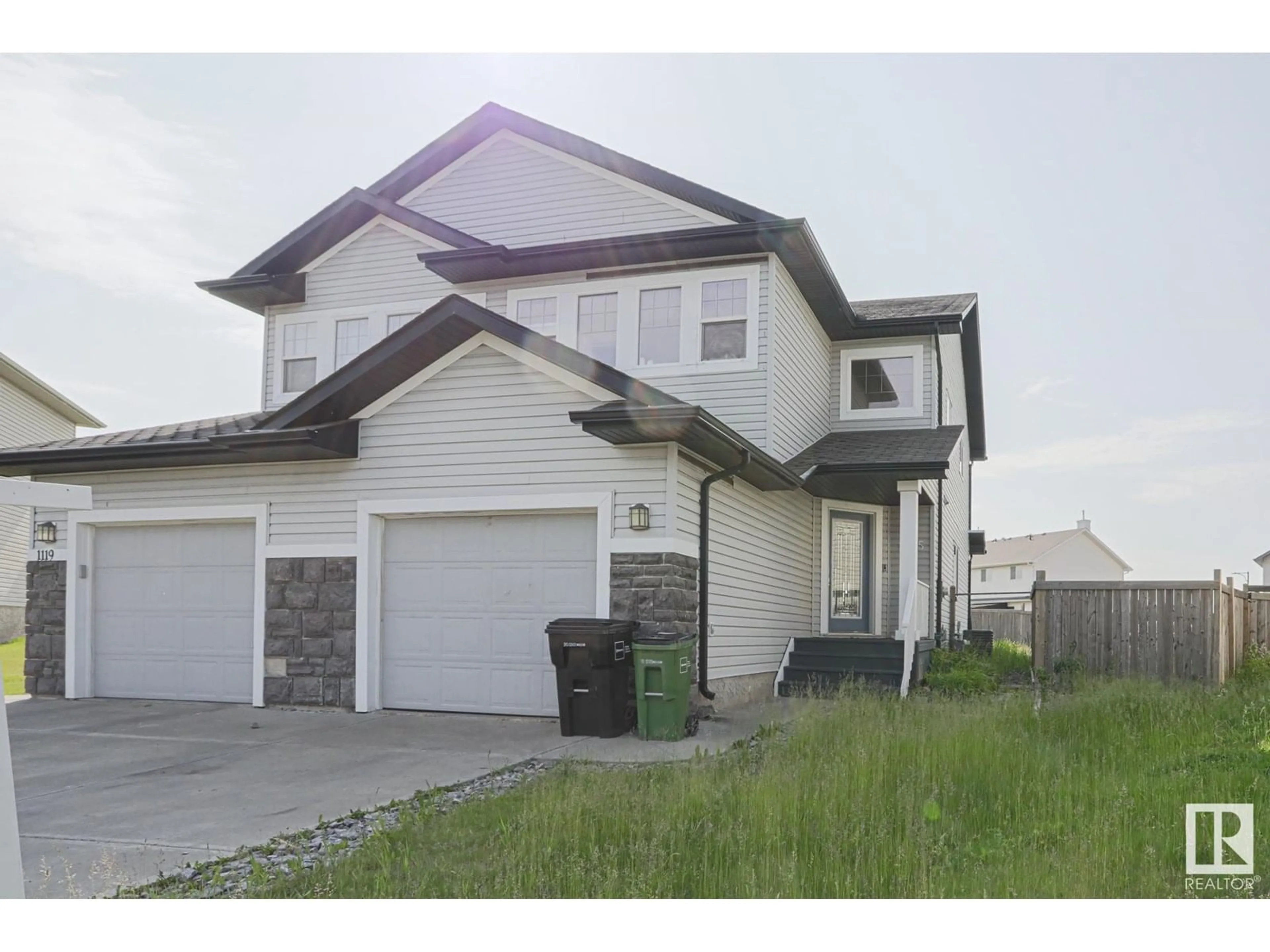 Home with vinyl exterior material, street for NW - 1125 37B AV, Edmonton Alberta T6T0E6