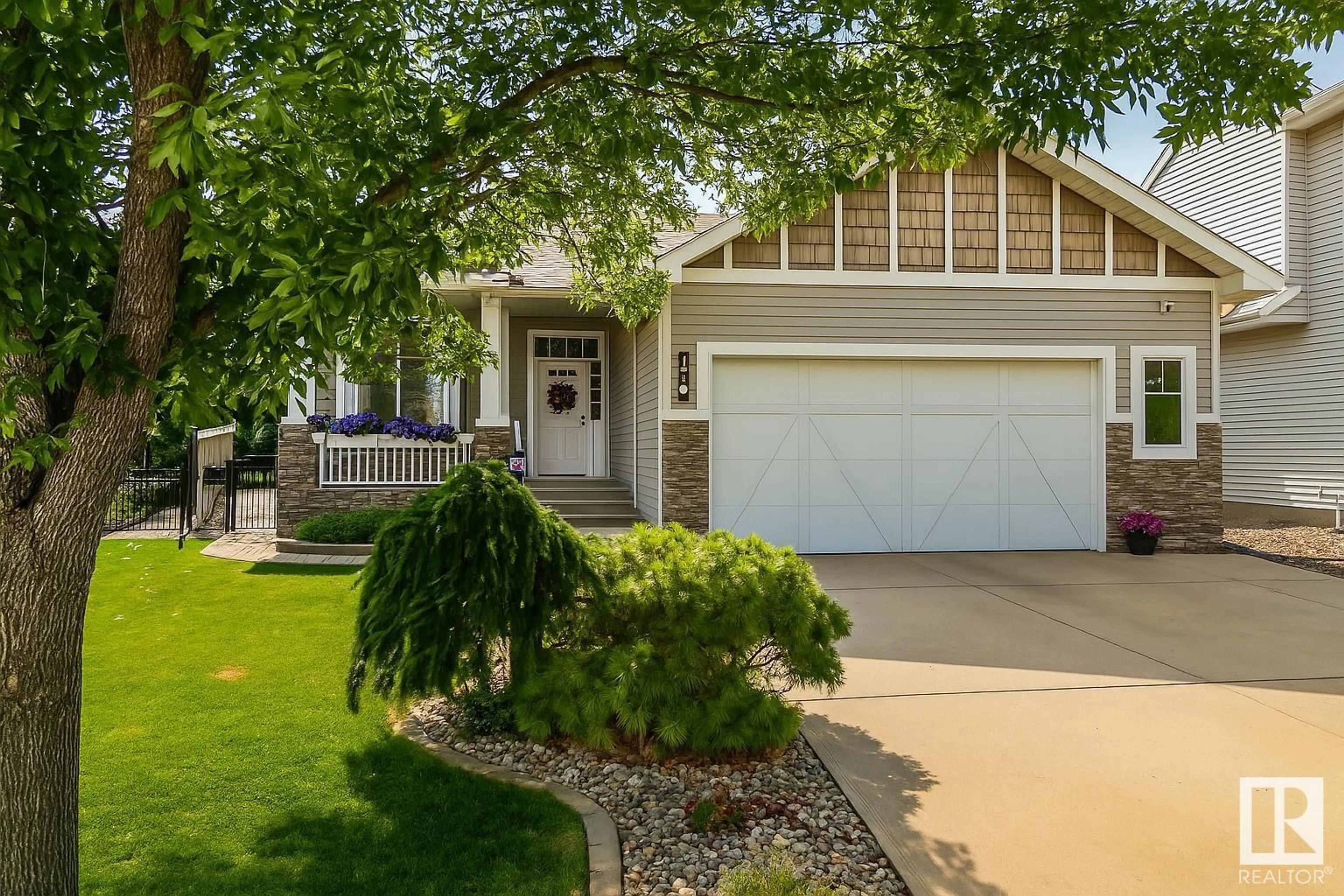 Home with vinyl exterior material, street for NW - 4814 209A ST, Edmonton Alberta T6M3A3