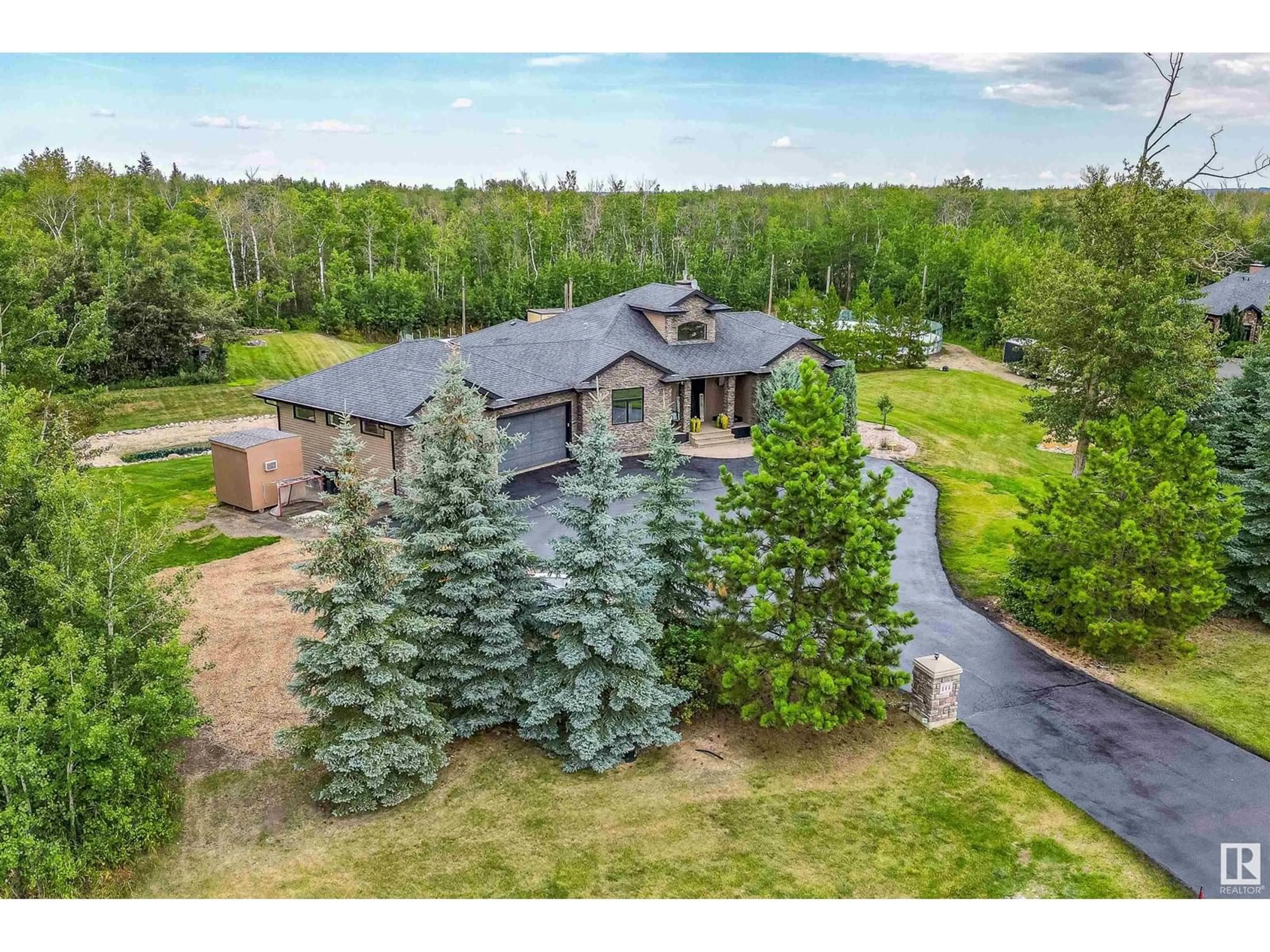 A pic from outside/outdoor area/front of a property/back of a property/a pic from drone, mountain view for 53025 RGE RD 223, Rural Strathcona County Alberta T8E2M3
