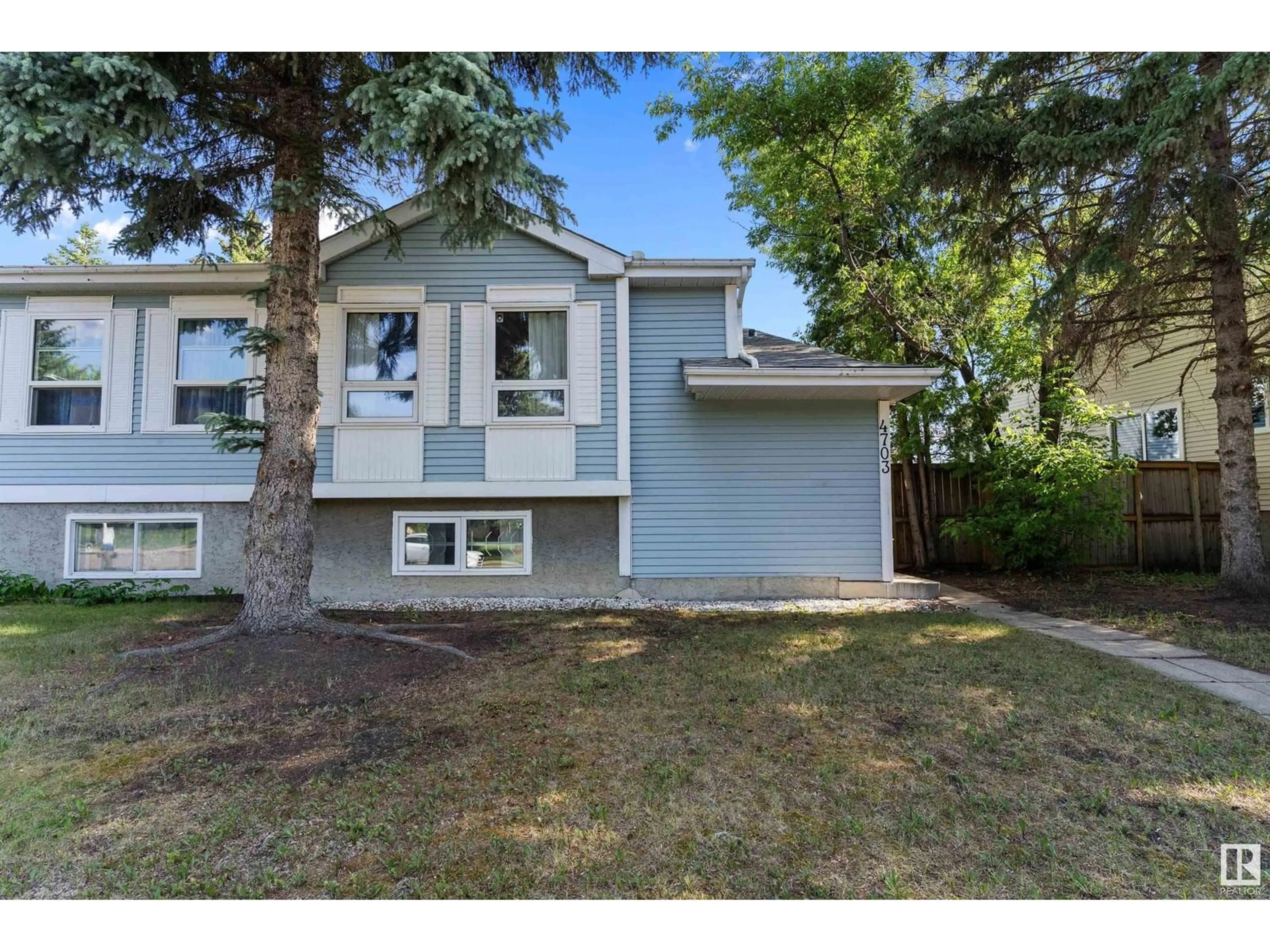 Home with vinyl exterior material, street for 4703 36 AV, Edmonton Alberta T6L3S2