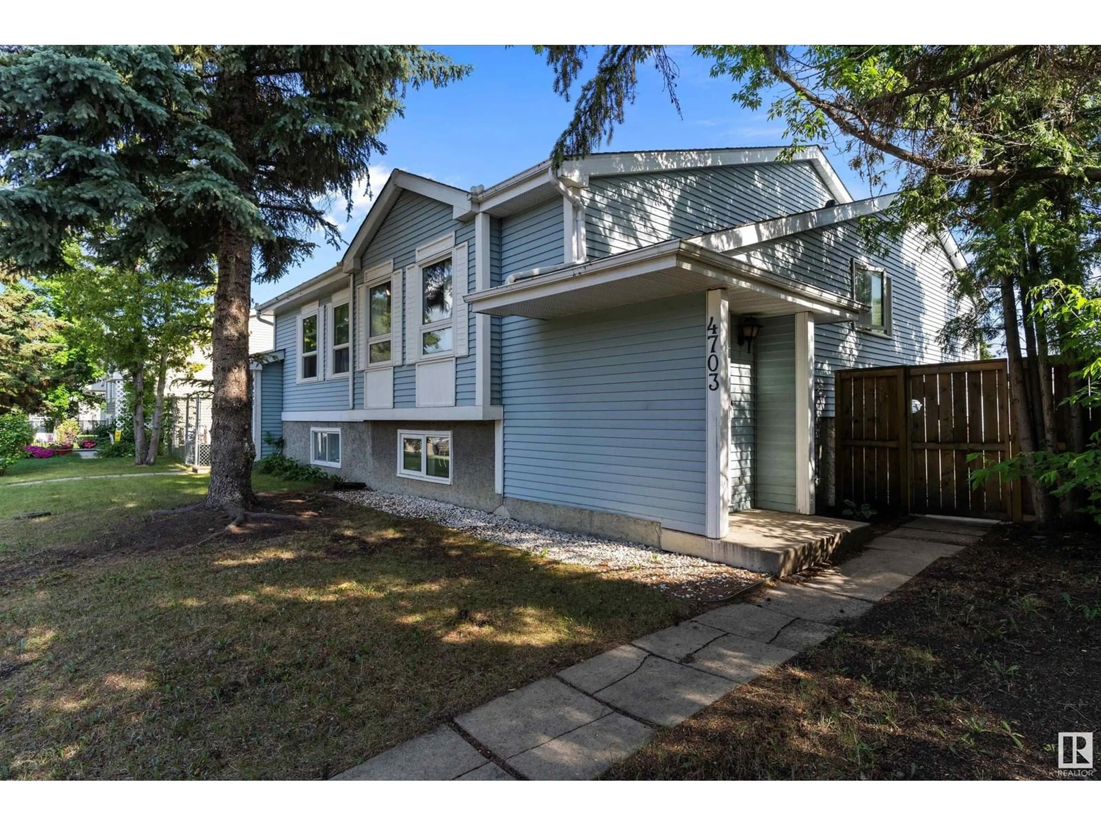 Home with vinyl exterior material, street for 4703 36 AV, Edmonton Alberta T6L3S2