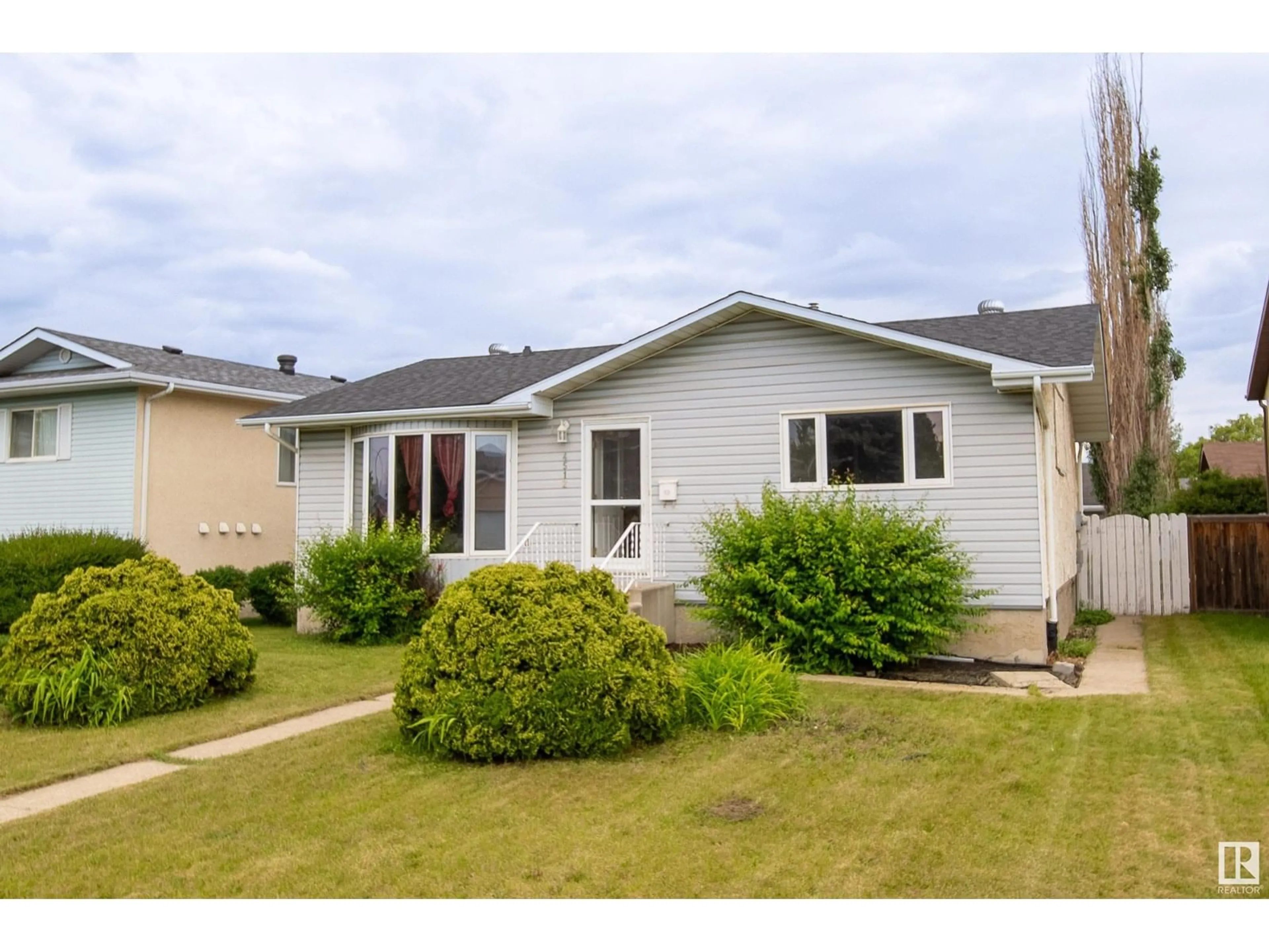 Home with vinyl exterior material, street for 4512 12 AV, Edmonton Alberta T6L3L7