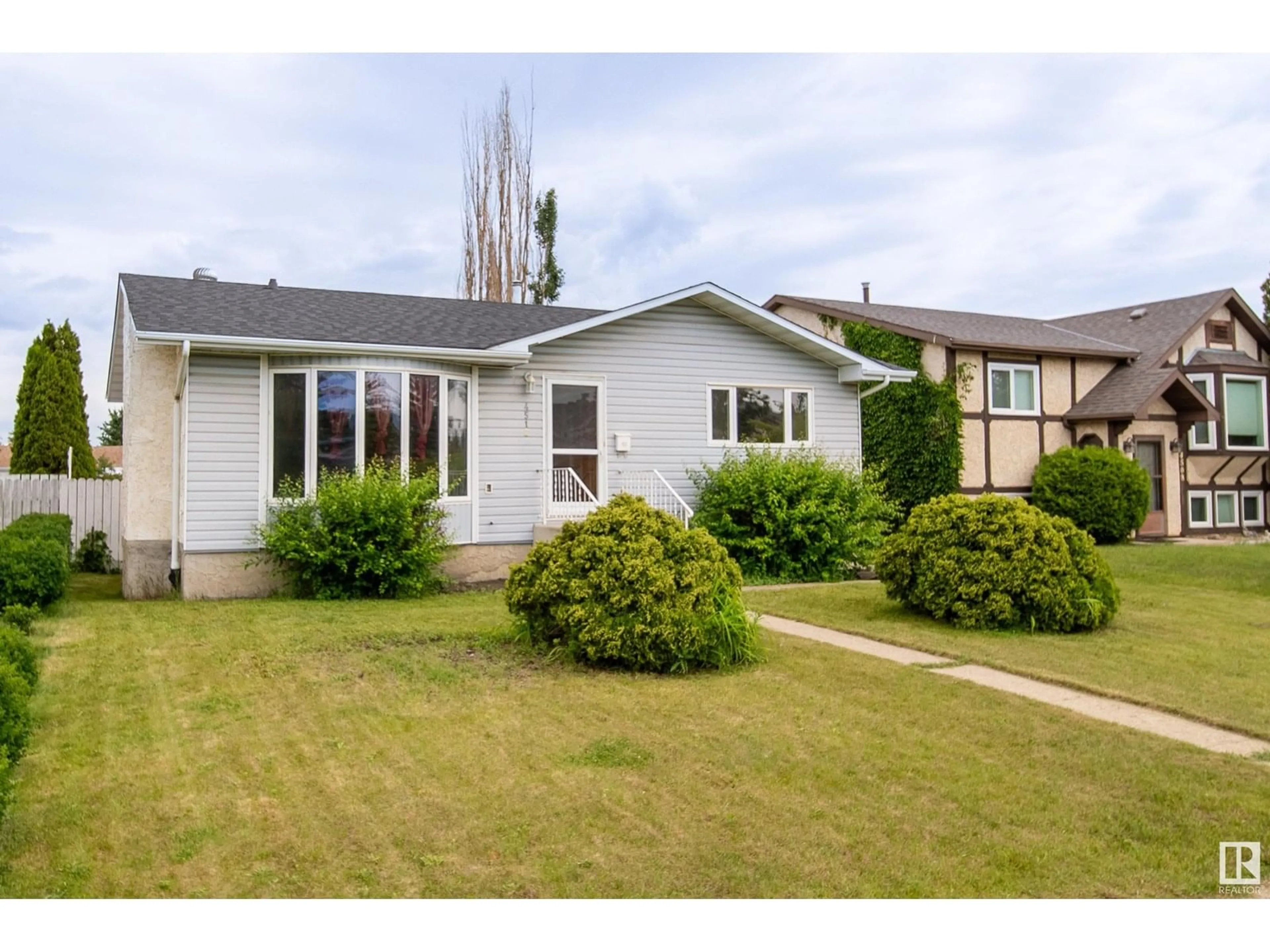 Home with vinyl exterior material, street for 4512 12 AV, Edmonton Alberta T6L3L7