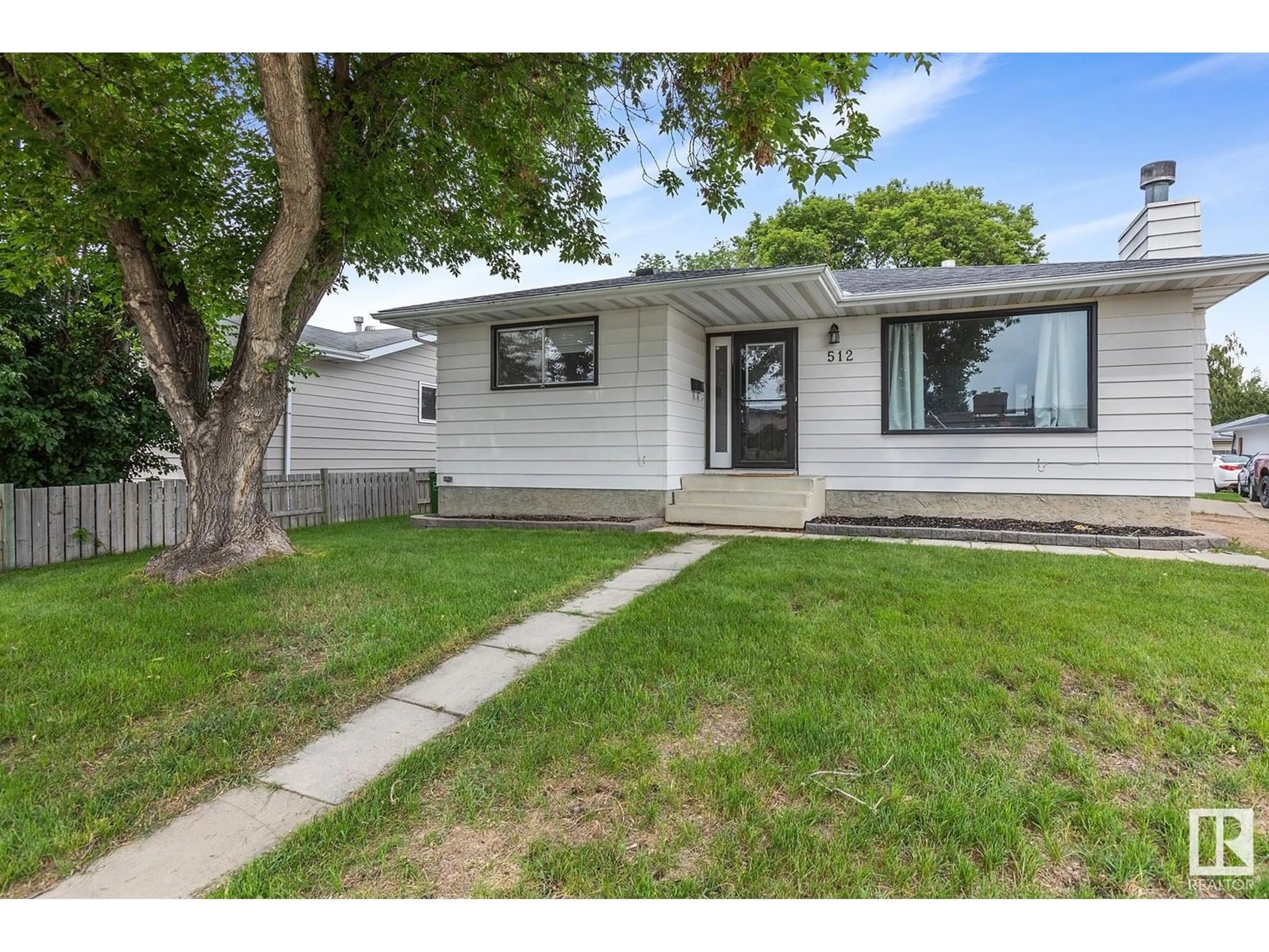 Home with vinyl exterior material, street for NW - 512 KNOTTWOOD W, Edmonton Alberta T6K1W8