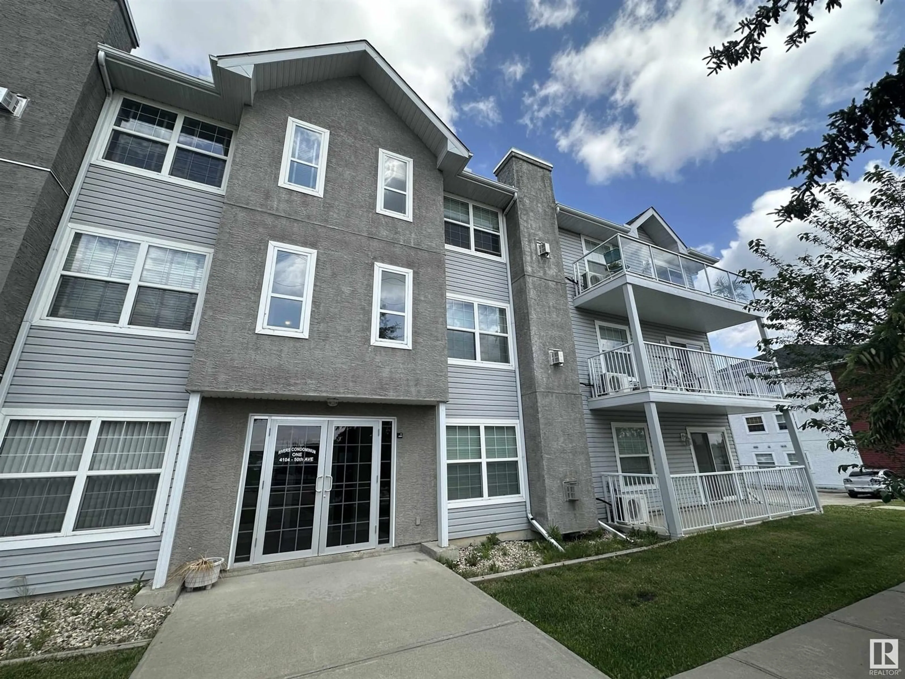 A pic from outside/outdoor area/front of a property/back of a property/a pic from drone, building for 103 - 4104 50 AVENUE, Drayton Valley Alberta T7A0A3