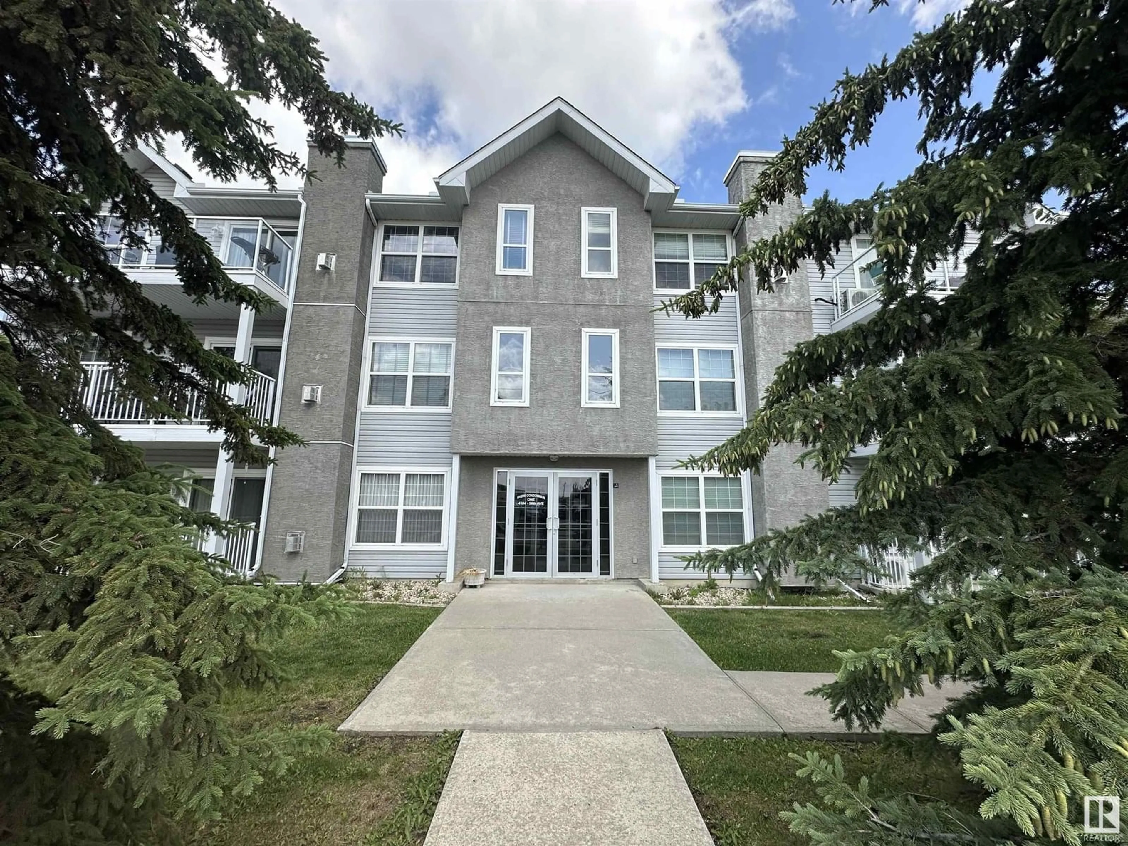 A pic from outside/outdoor area/front of a property/back of a property/a pic from drone, building for 103 - 4104 50 AVENUE, Drayton Valley Alberta T7A0A3
