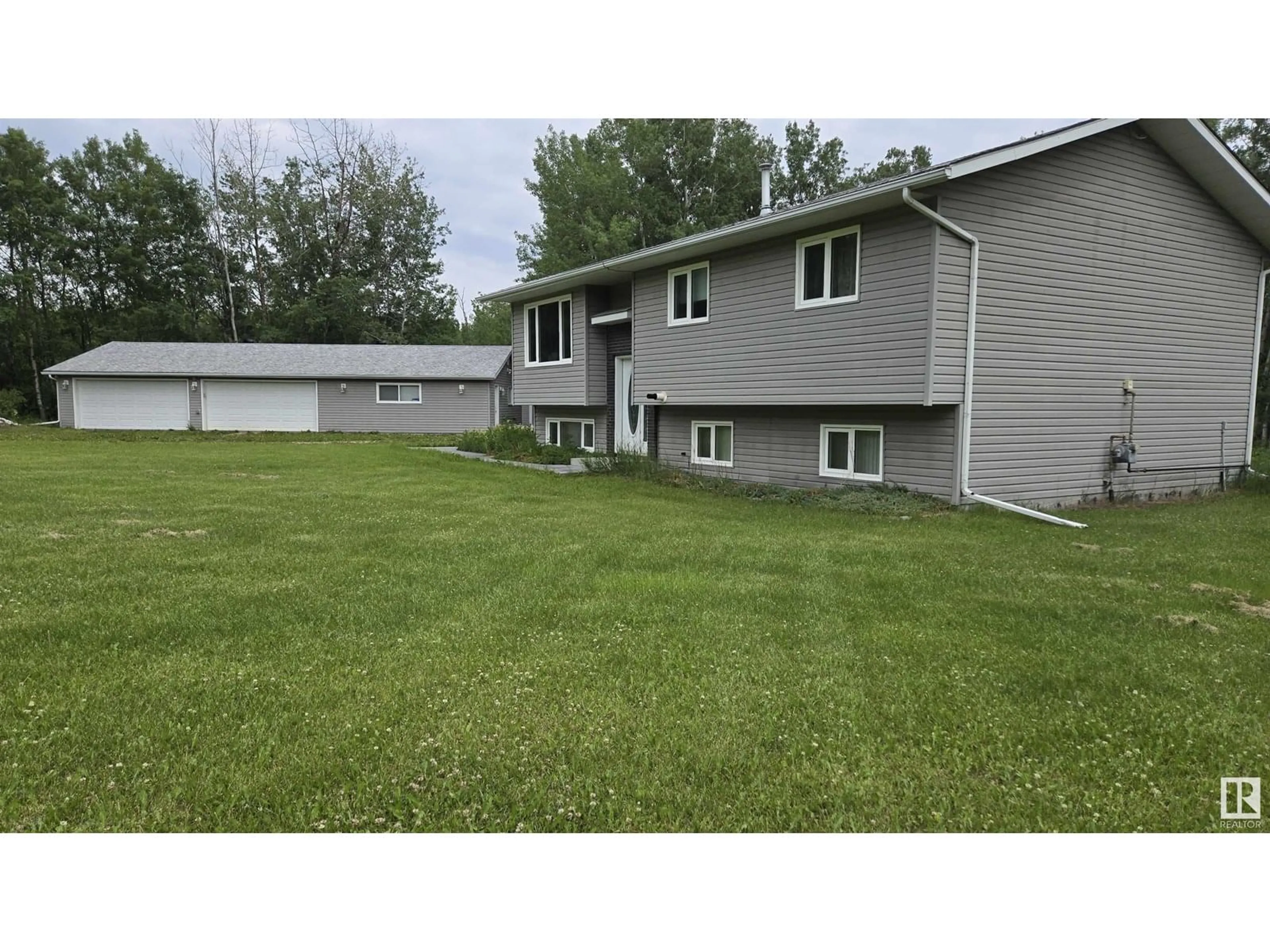 A pic from outside/outdoor area/front of a property/back of a property/a pic from drone, street for 13 - 52306 RGE ROAD 212, Rural Strathcona County Alberta T8G1C1