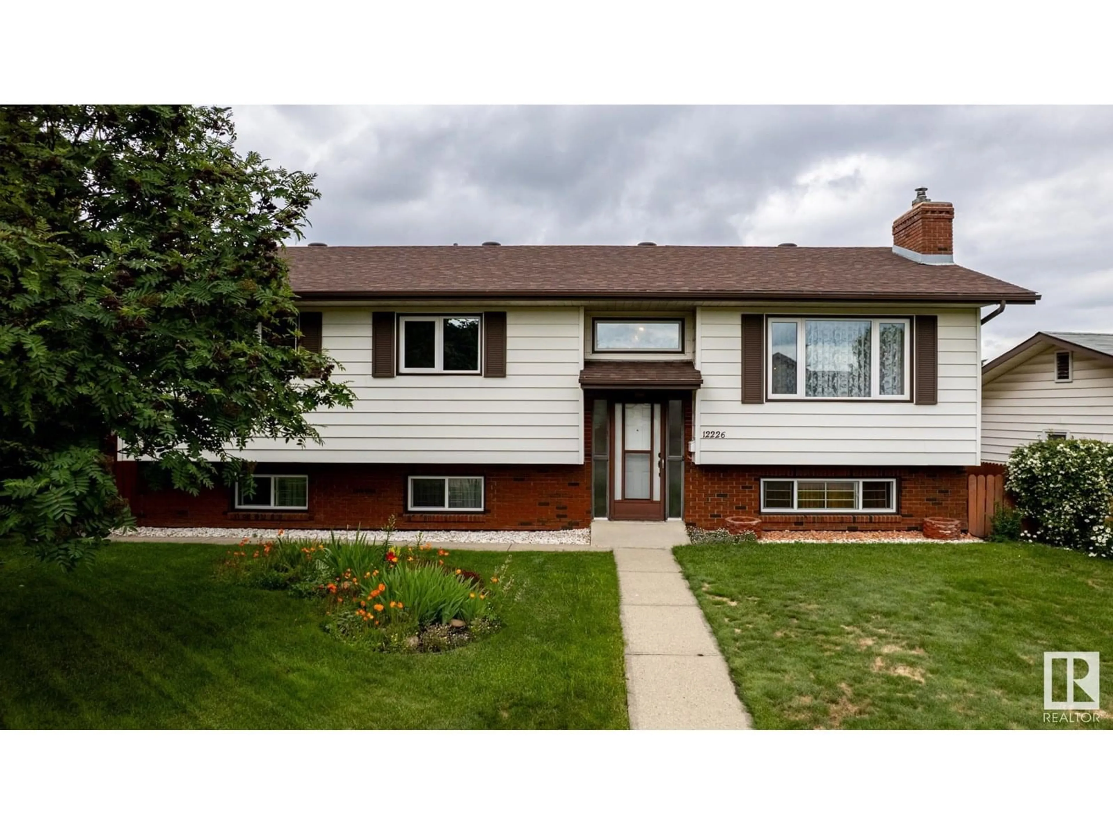 Home with vinyl exterior material, street for 12226 38 ST NW, Edmonton Alberta T5W2J3