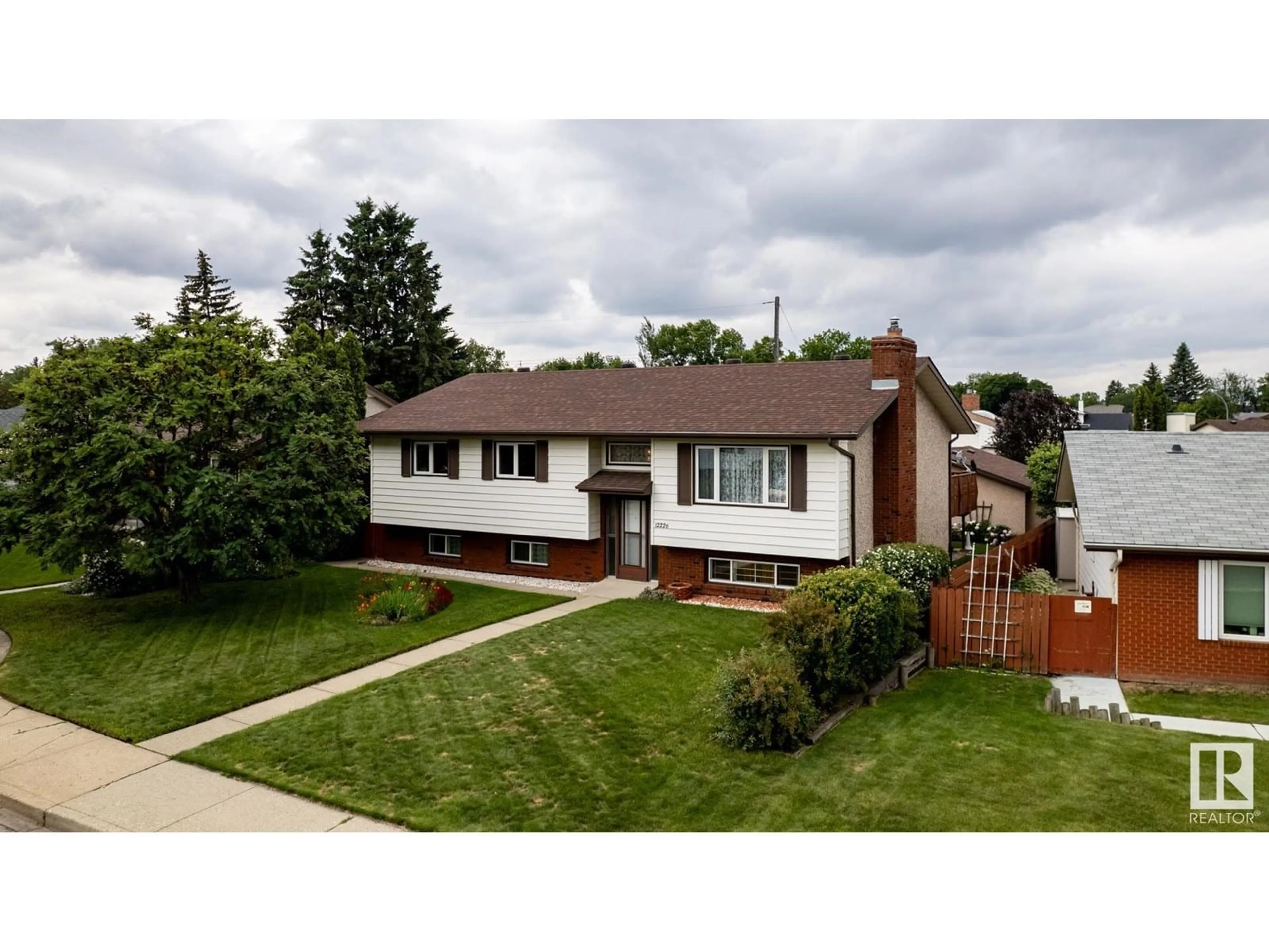 Home with brick exterior material, street for 12226 38 ST NW, Edmonton Alberta T5W2J3