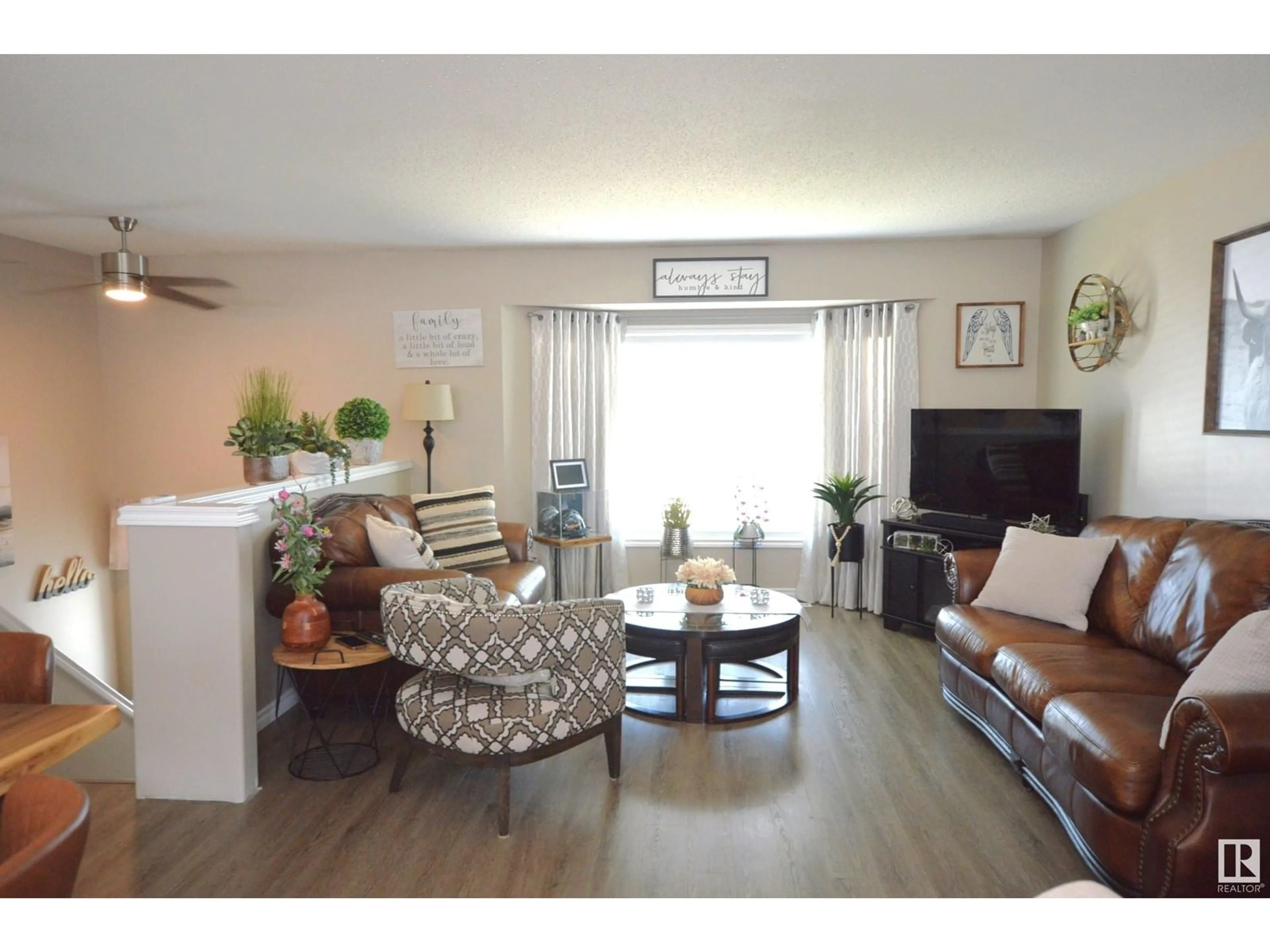 Living room with furniture, wood/laminate floor for 4716 39 ST, Bonnyville Town Alberta T9N0A3