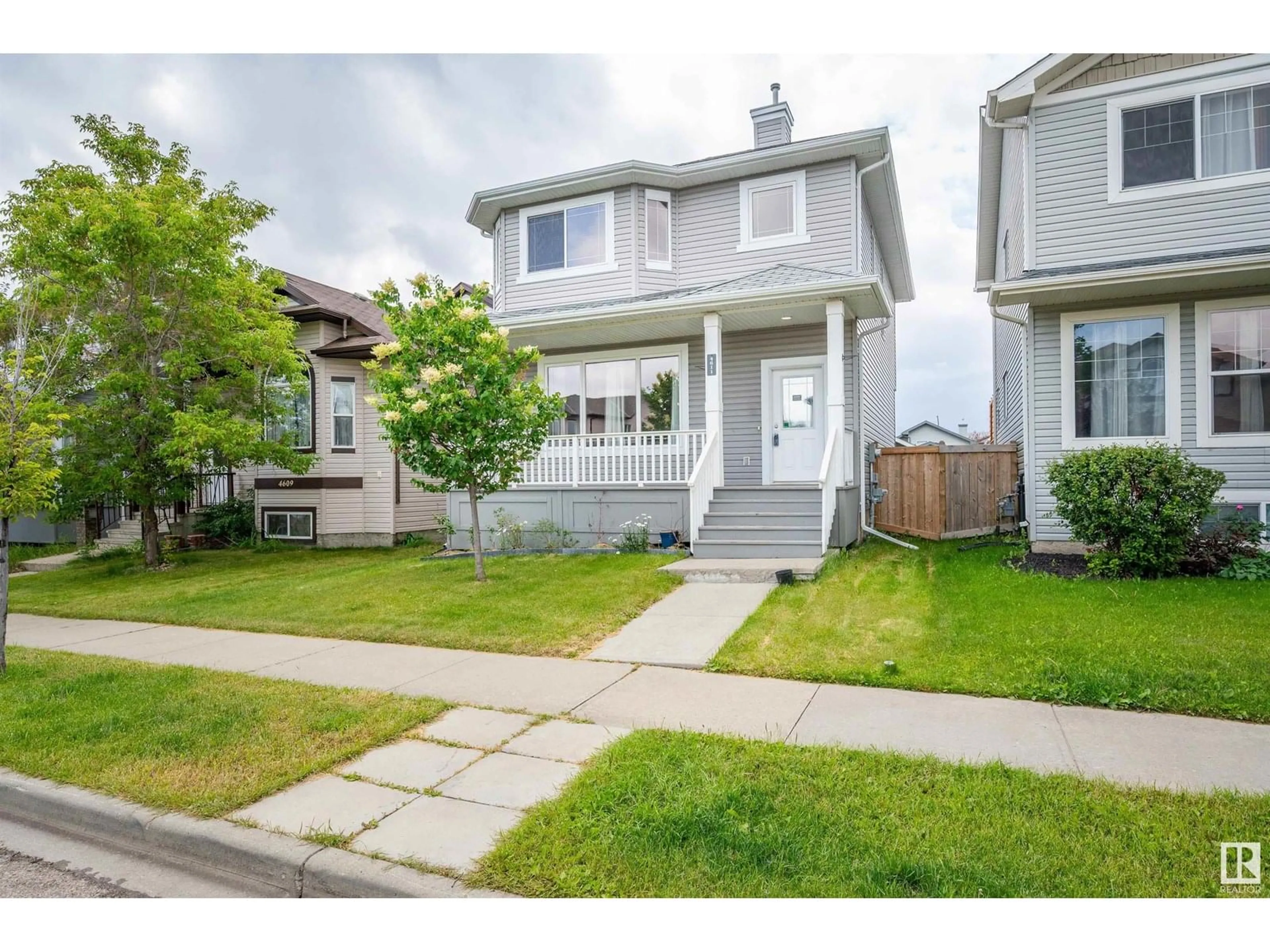 Home with vinyl exterior material, street for 4611 160 AV, Edmonton Alberta T5Y0G9