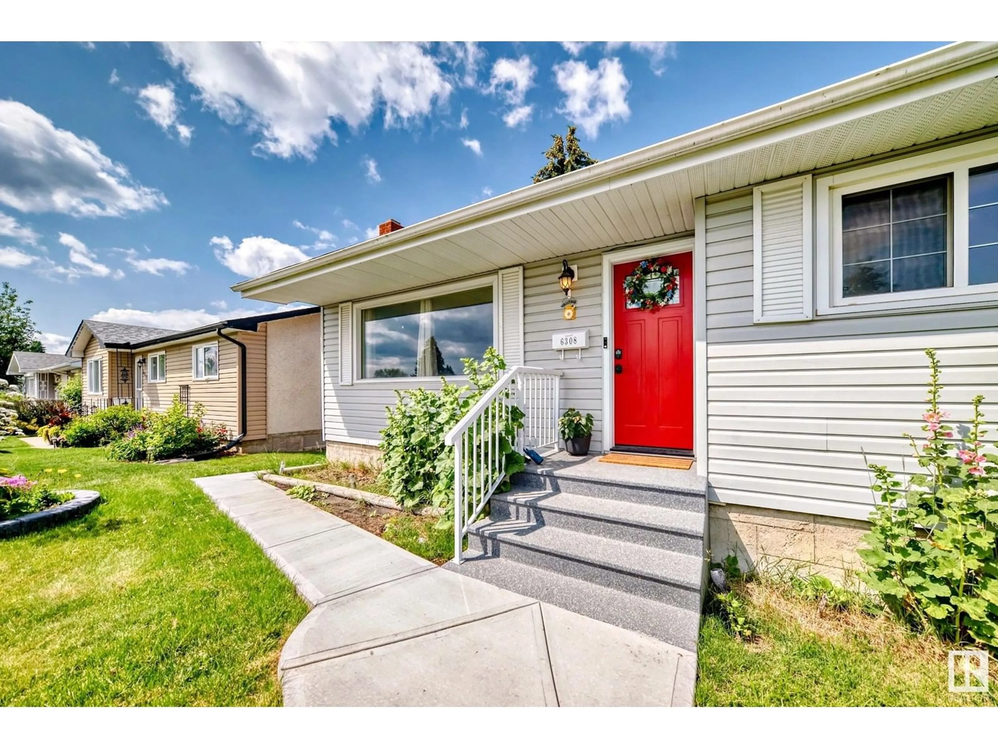 Home with vinyl exterior material, street for 6308 144A AV, Edmonton Alberta T5A1S4