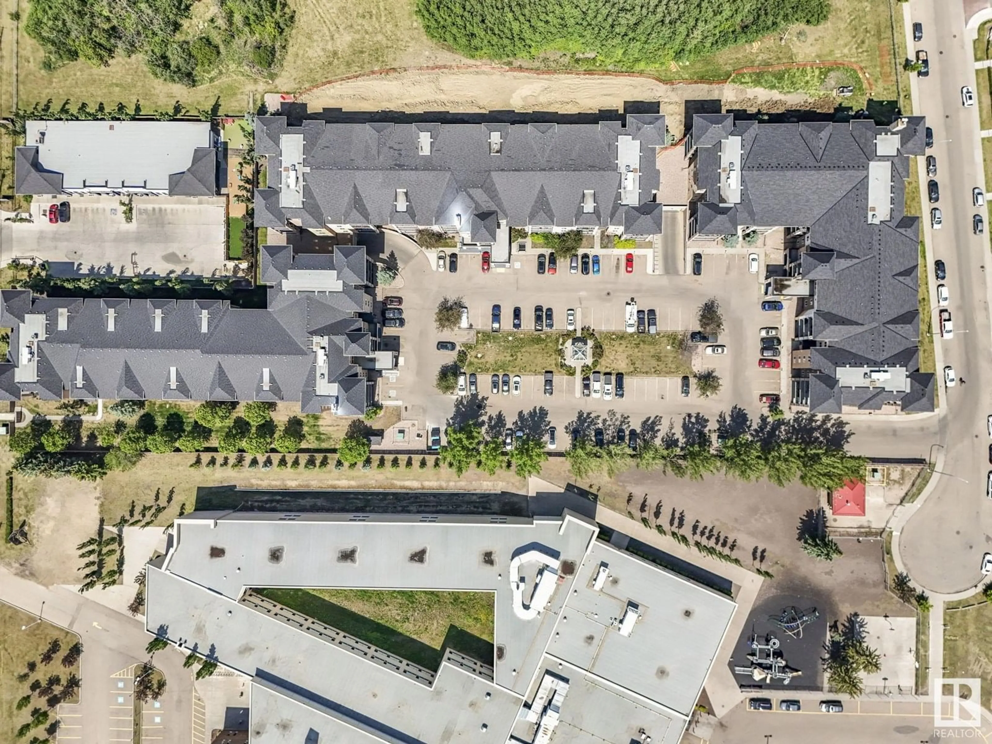 A pic from outside/outdoor area/front of a property/back of a property/a pic from drone, building for #104 - 14608 125 ST, Edmonton Alberta T5X0B5