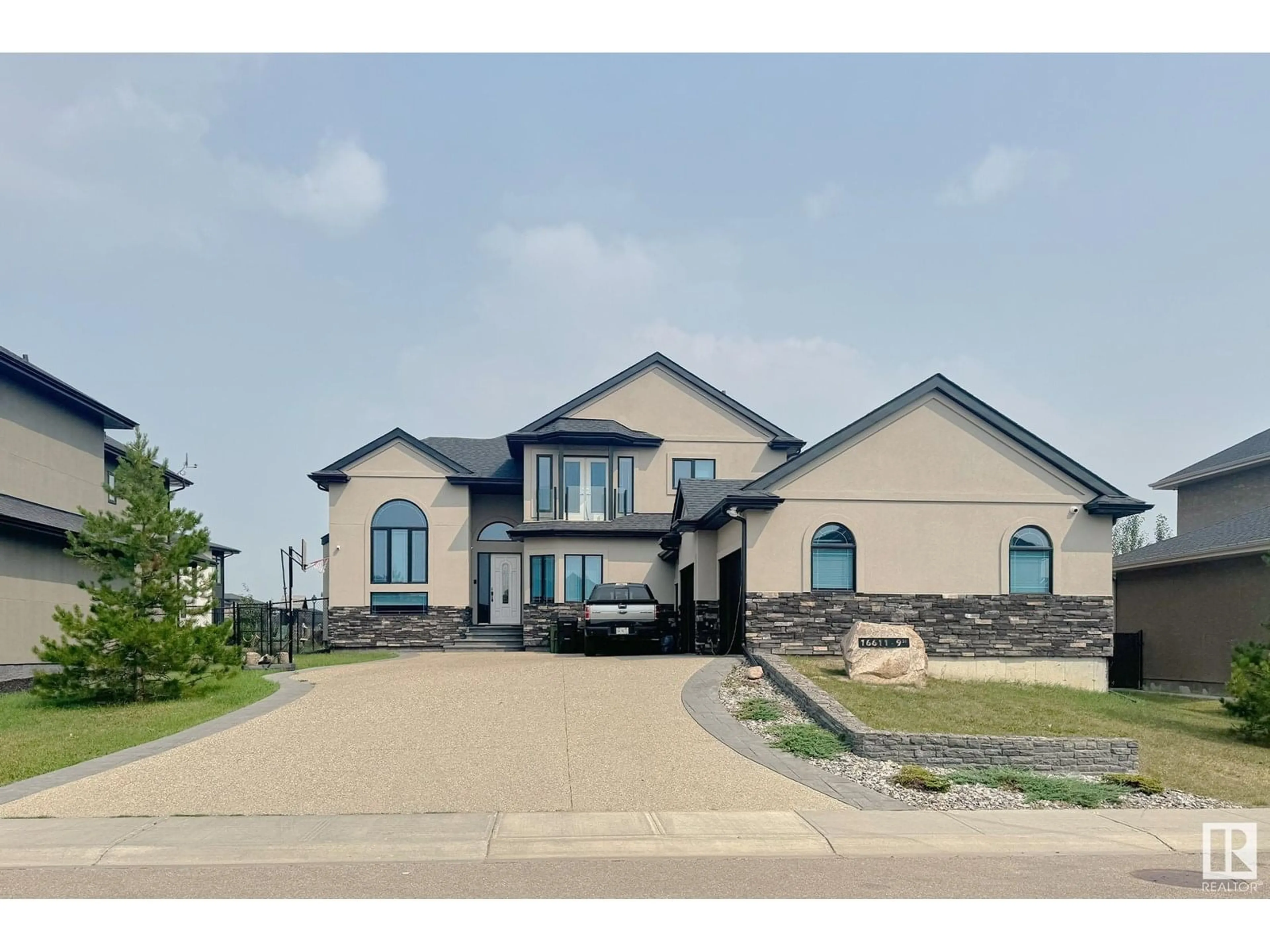 Home with brick exterior material, street for 16611 9 ST NE, Edmonton Alberta T5Y0P6