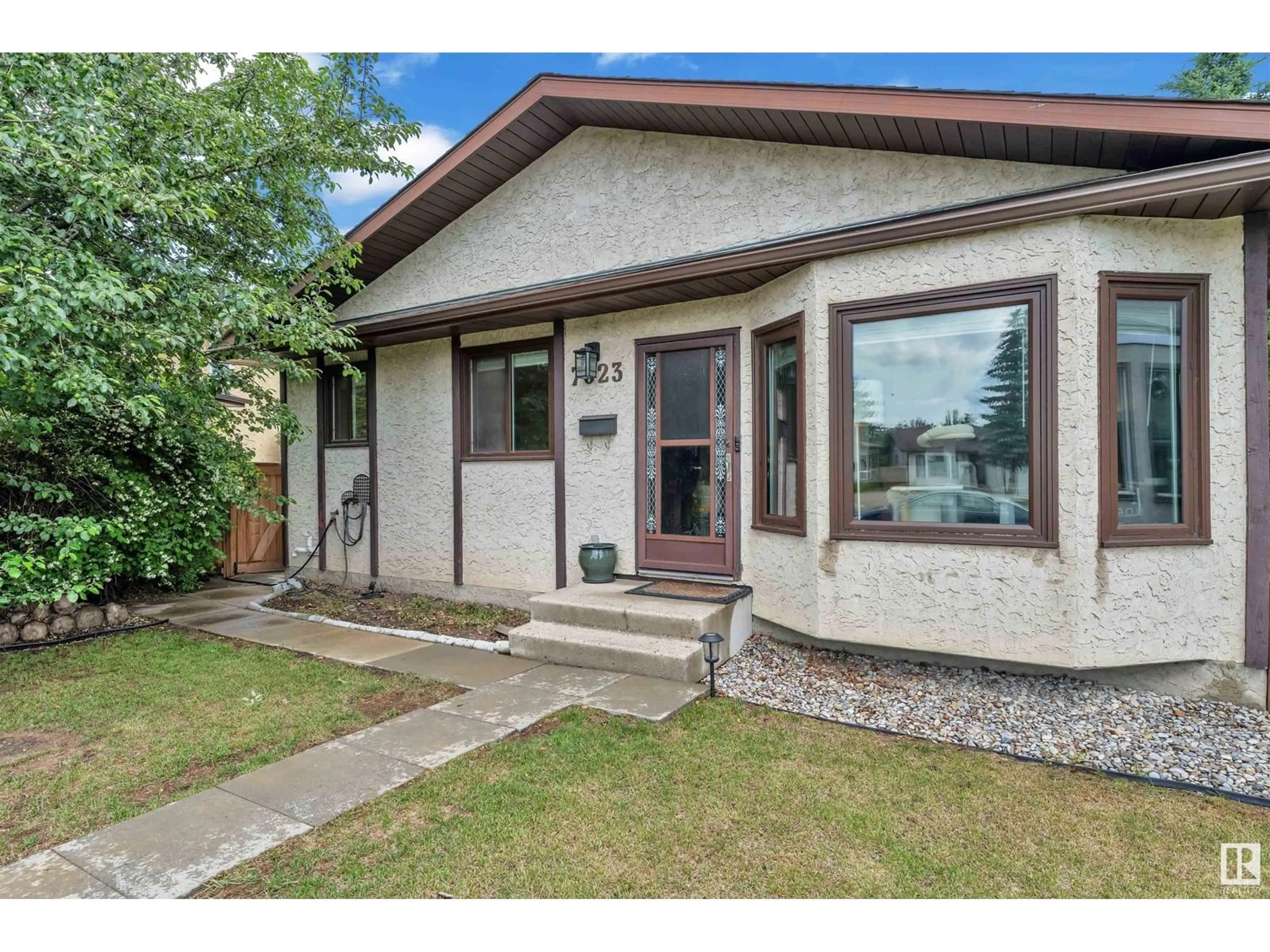 Home with vinyl exterior material, street for NW - 7023 189 ST, Edmonton Alberta T5T5E3