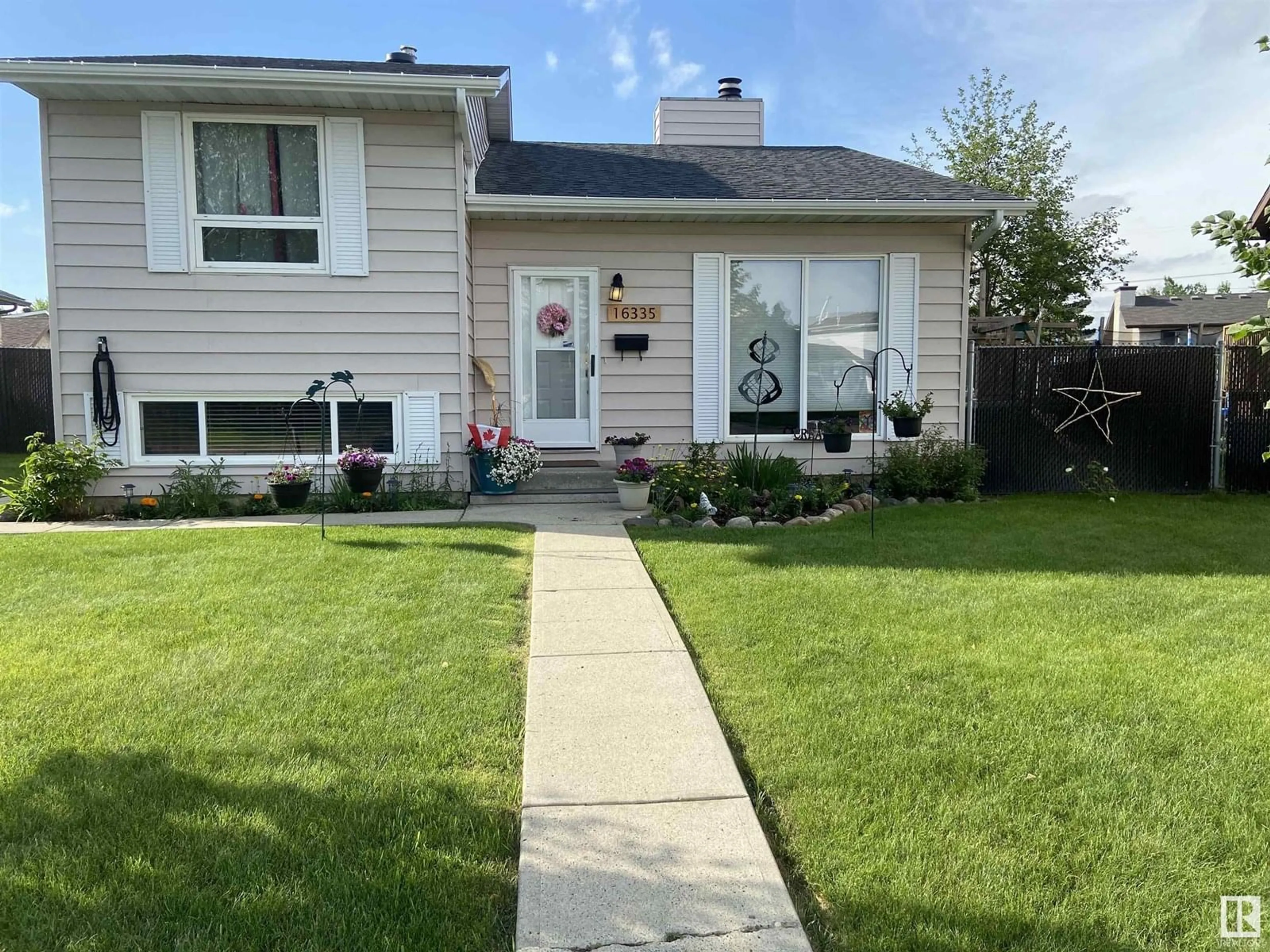 Home with vinyl exterior material, street for NW - 16335 119 ST, Edmonton Alberta T5X4Z3