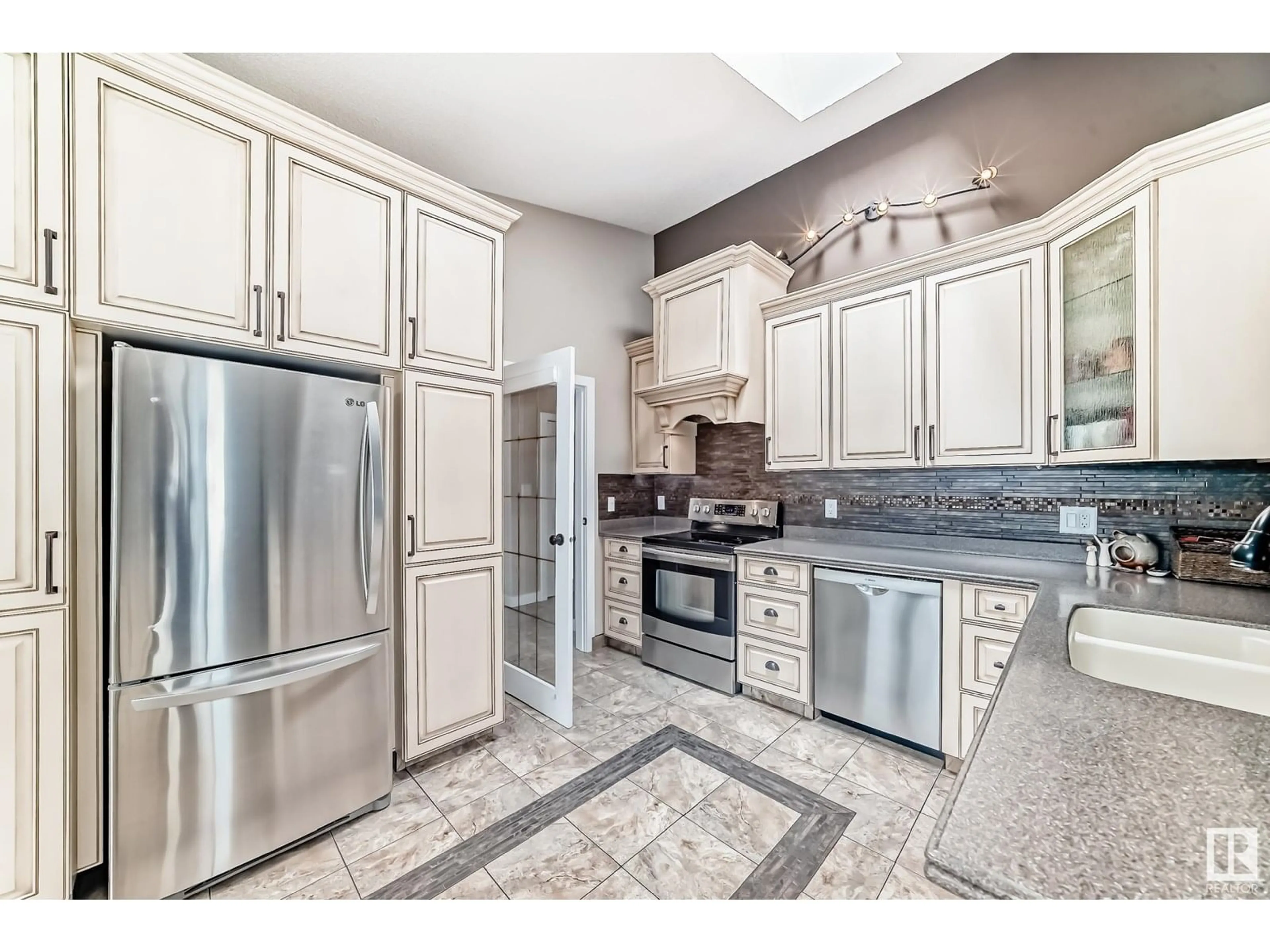 Open concept kitchen, ceramic/tile floor for NW - 4019 104 ST, Edmonton Alberta T6J6K9