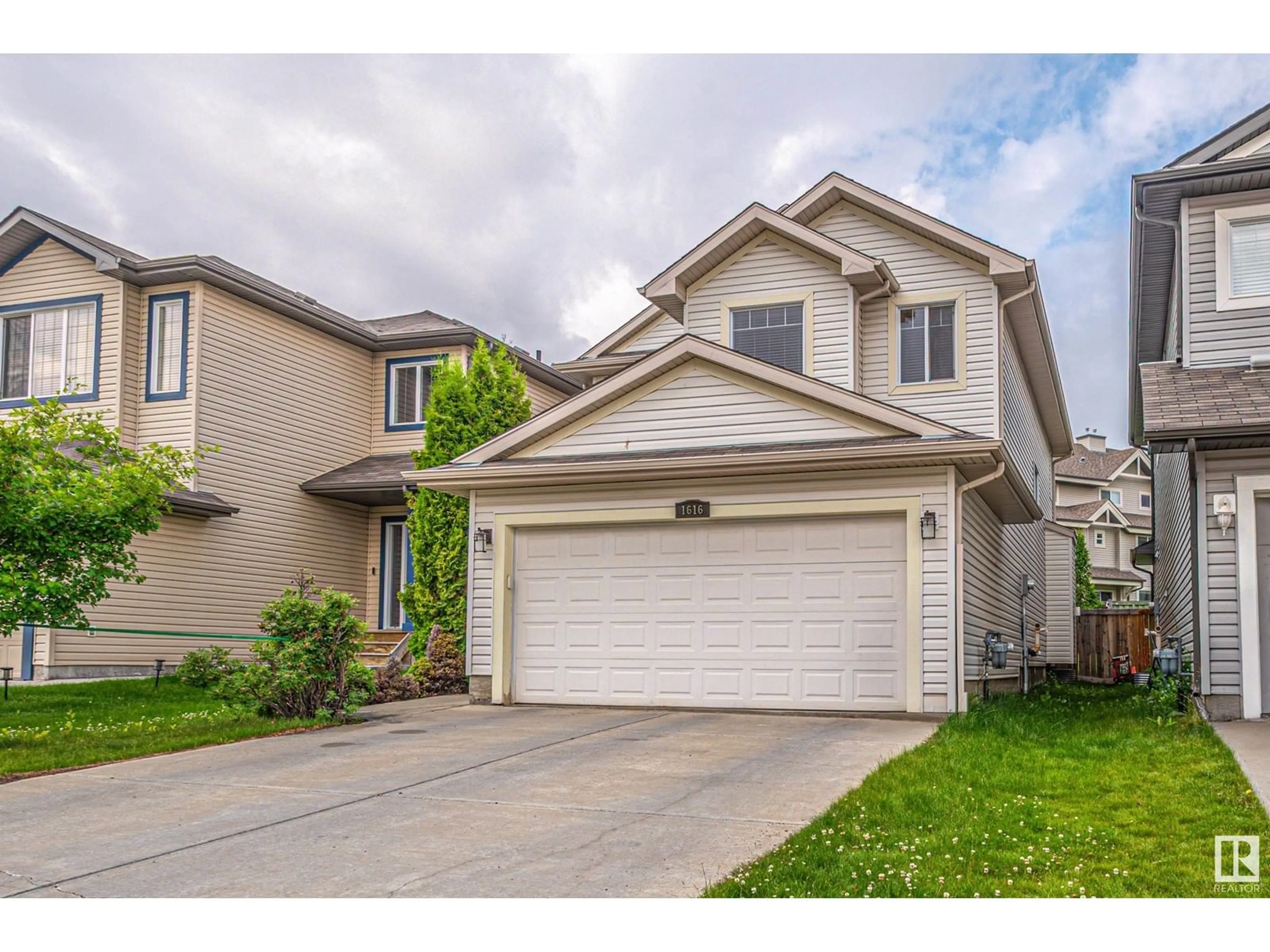 Home with vinyl exterior material, street for 1616 118 ST, Edmonton Alberta T6W1M9