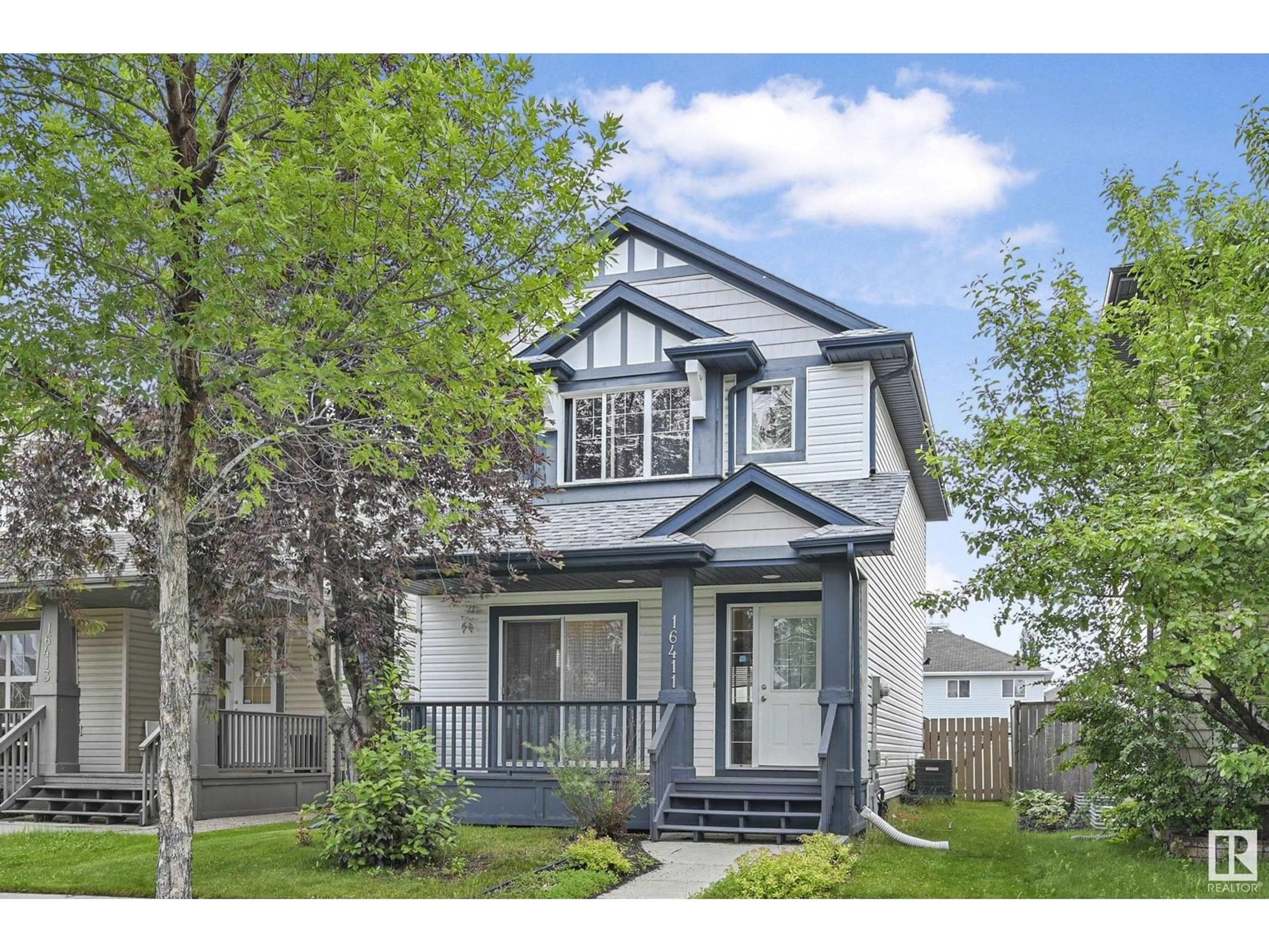 Home with vinyl exterior material, street for 16411 57 ST, Edmonton Alberta T5Y0A2