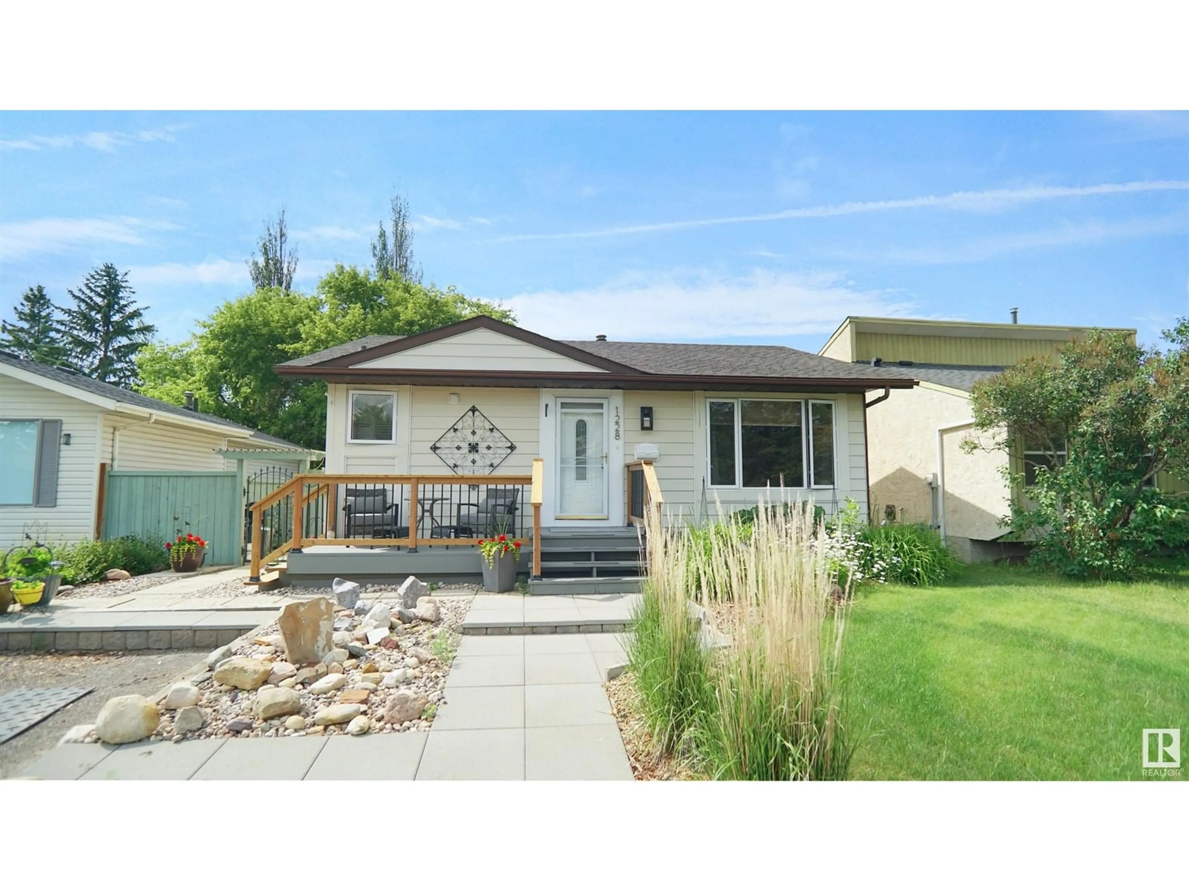 Home with vinyl exterior material, street for NW - 1228 65 ST, Edmonton Alberta T6L2E7