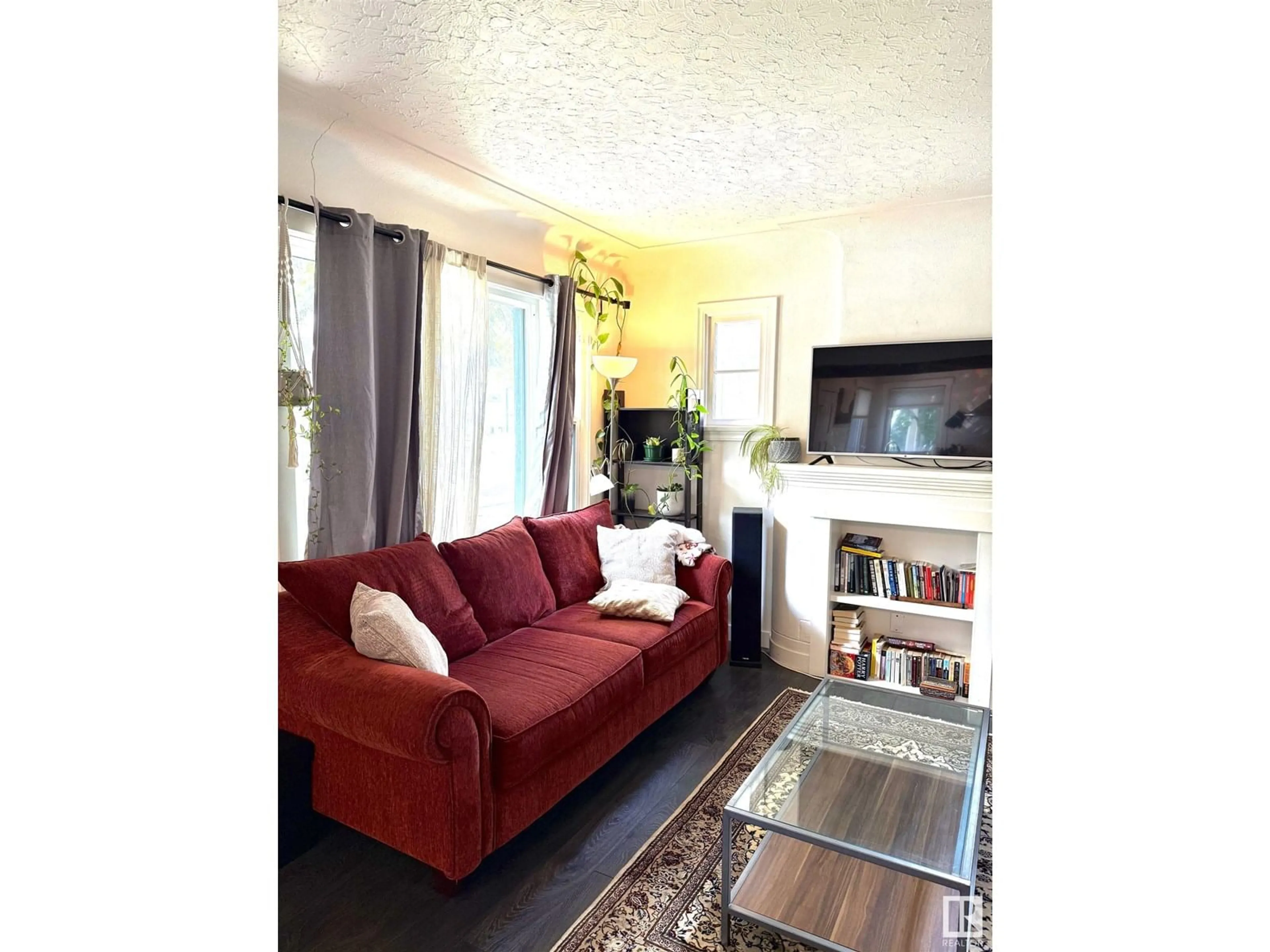 Living room with furniture, unknown for 10915 67 AV, Edmonton Alberta T6H2A5