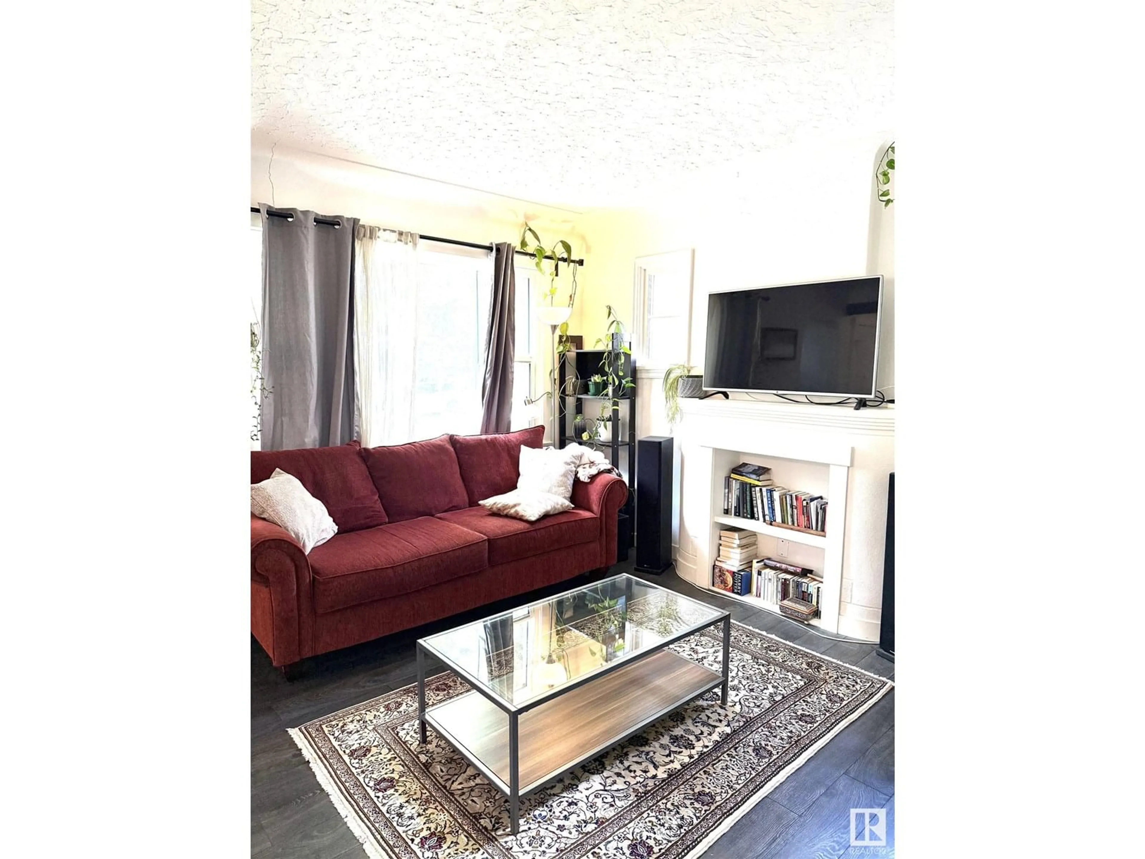 Living room with furniture, unknown for 10915 67 AV, Edmonton Alberta T6H2A5