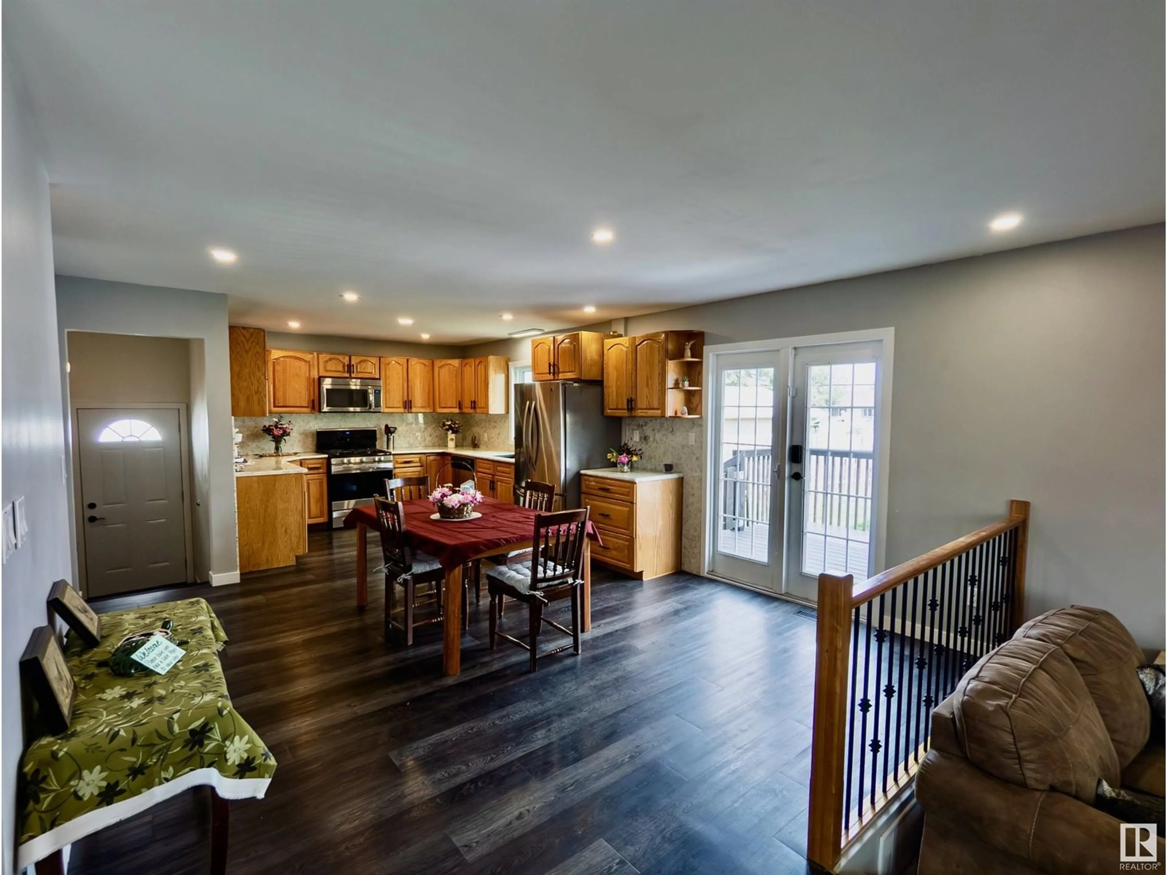 Open concept kitchen, wood/laminate floor for 10524 104 ST, Westlock Alberta T7P1M1