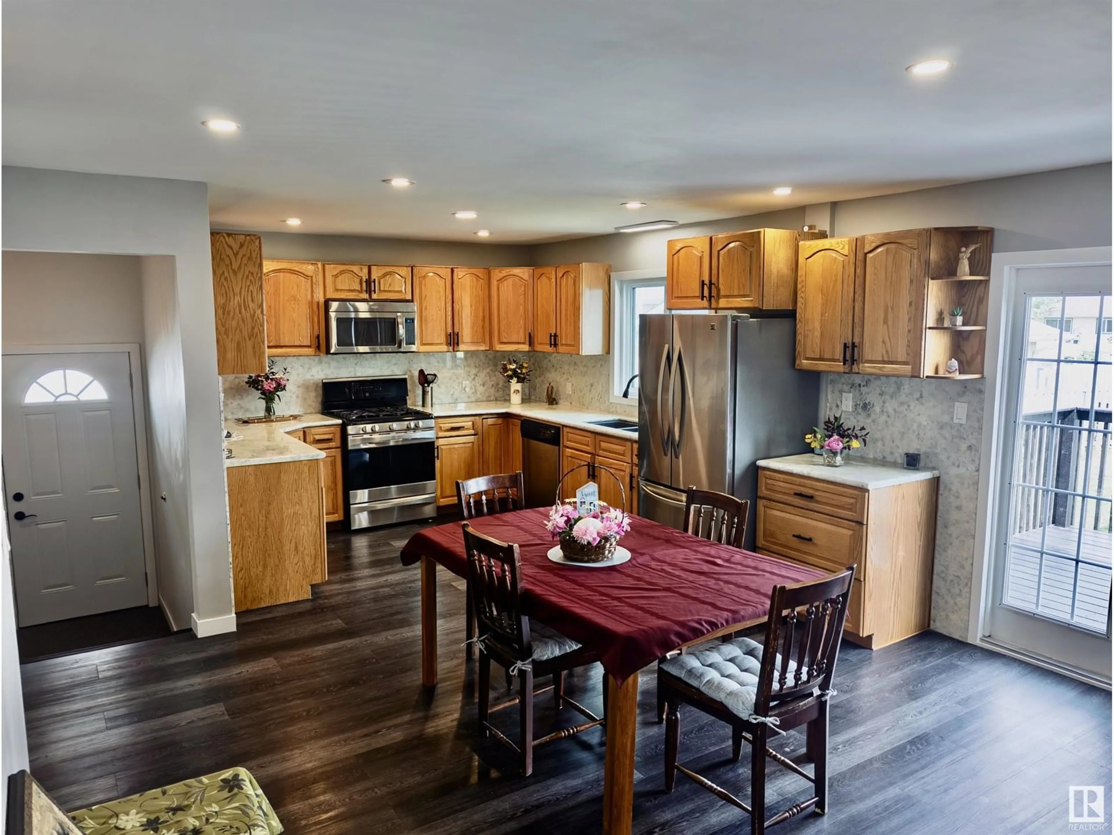 Open concept kitchen, wood/laminate floor for 10524 104 ST, Westlock Alberta T7P1M1