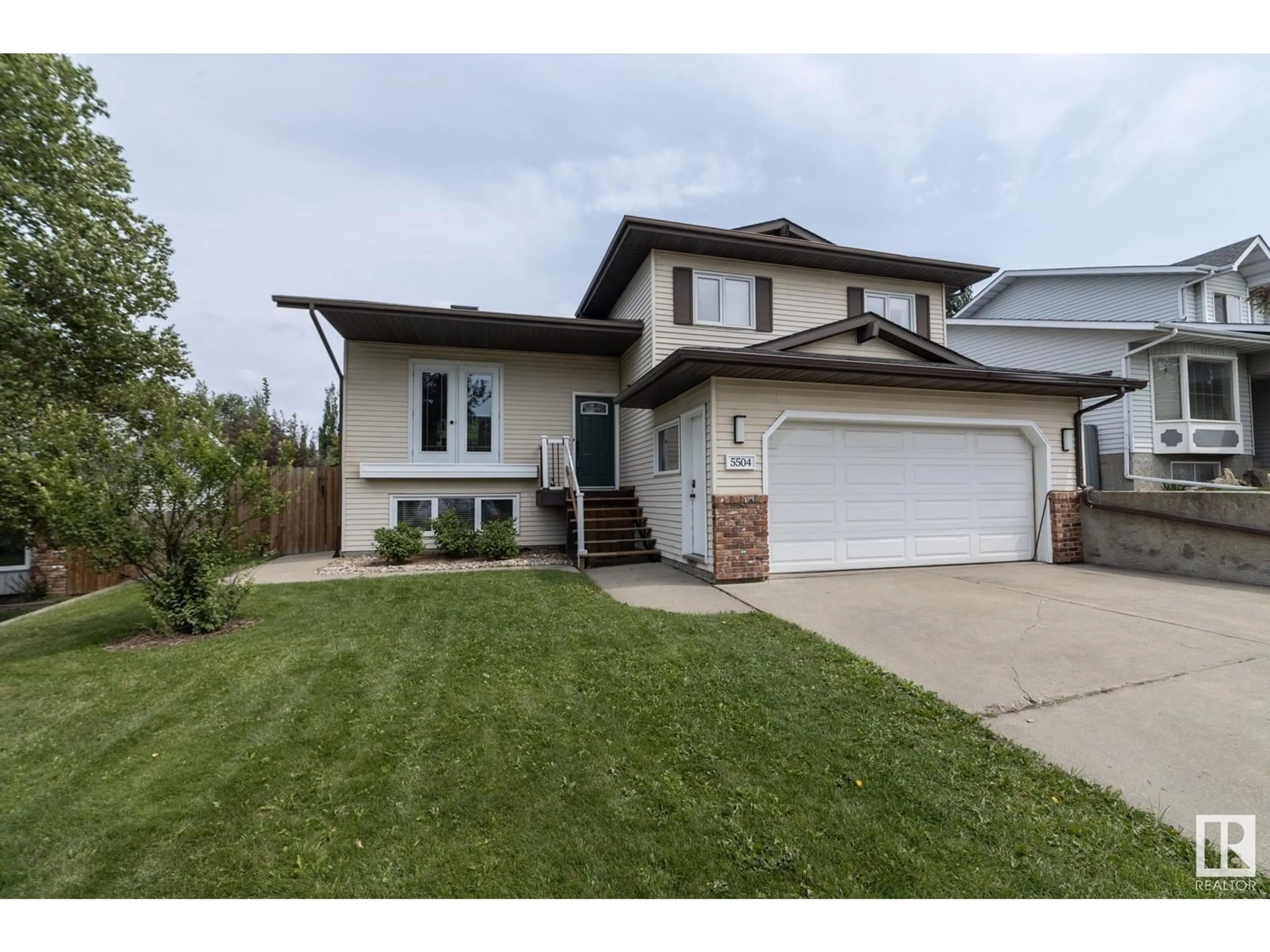 Home with vinyl exterior material, street for 5504 55 AV, Beaumont Alberta T4X1A2