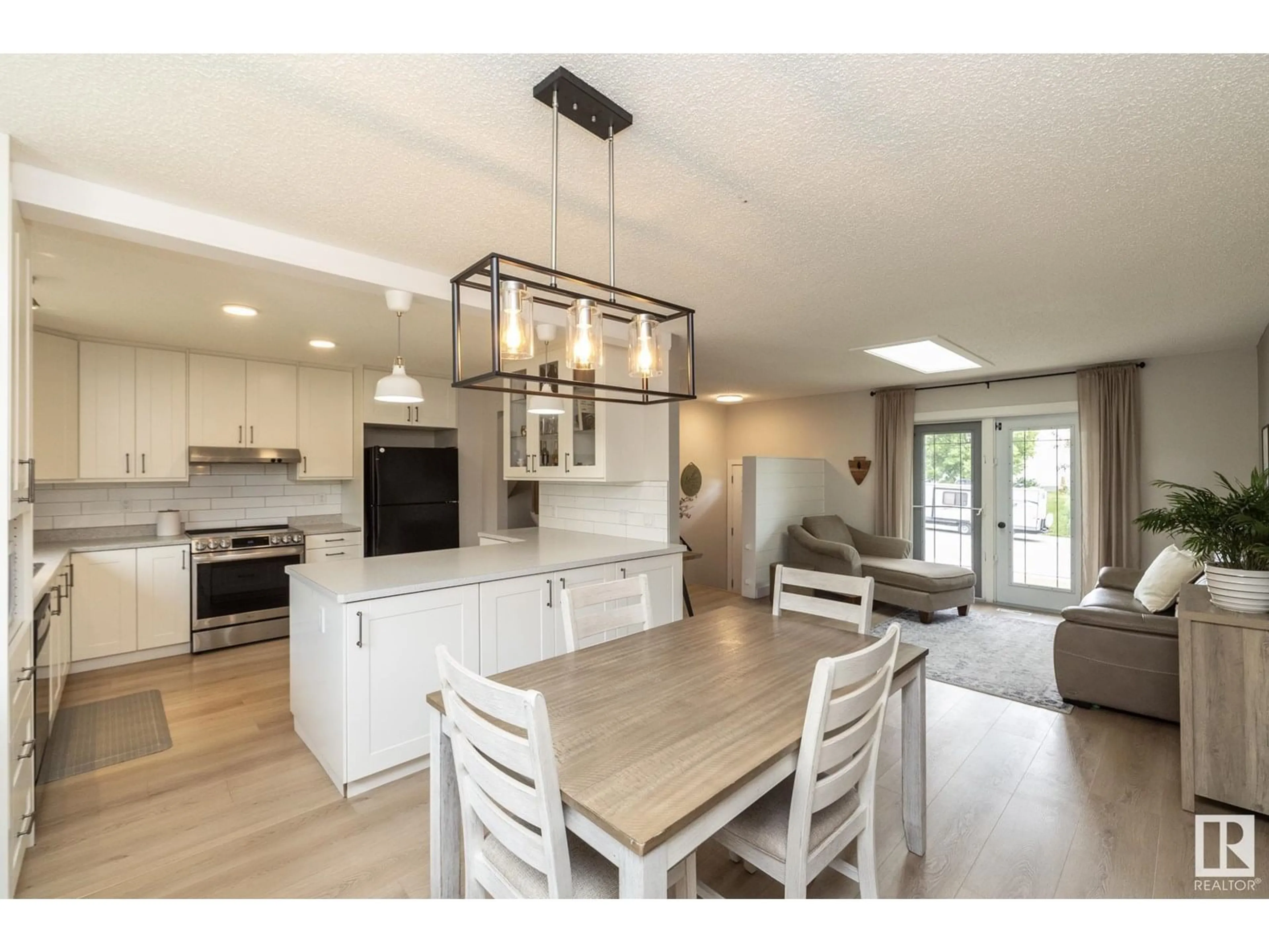 Open concept kitchen, wood/laminate floor for 5504 55 AV, Beaumont Alberta T4X1A2