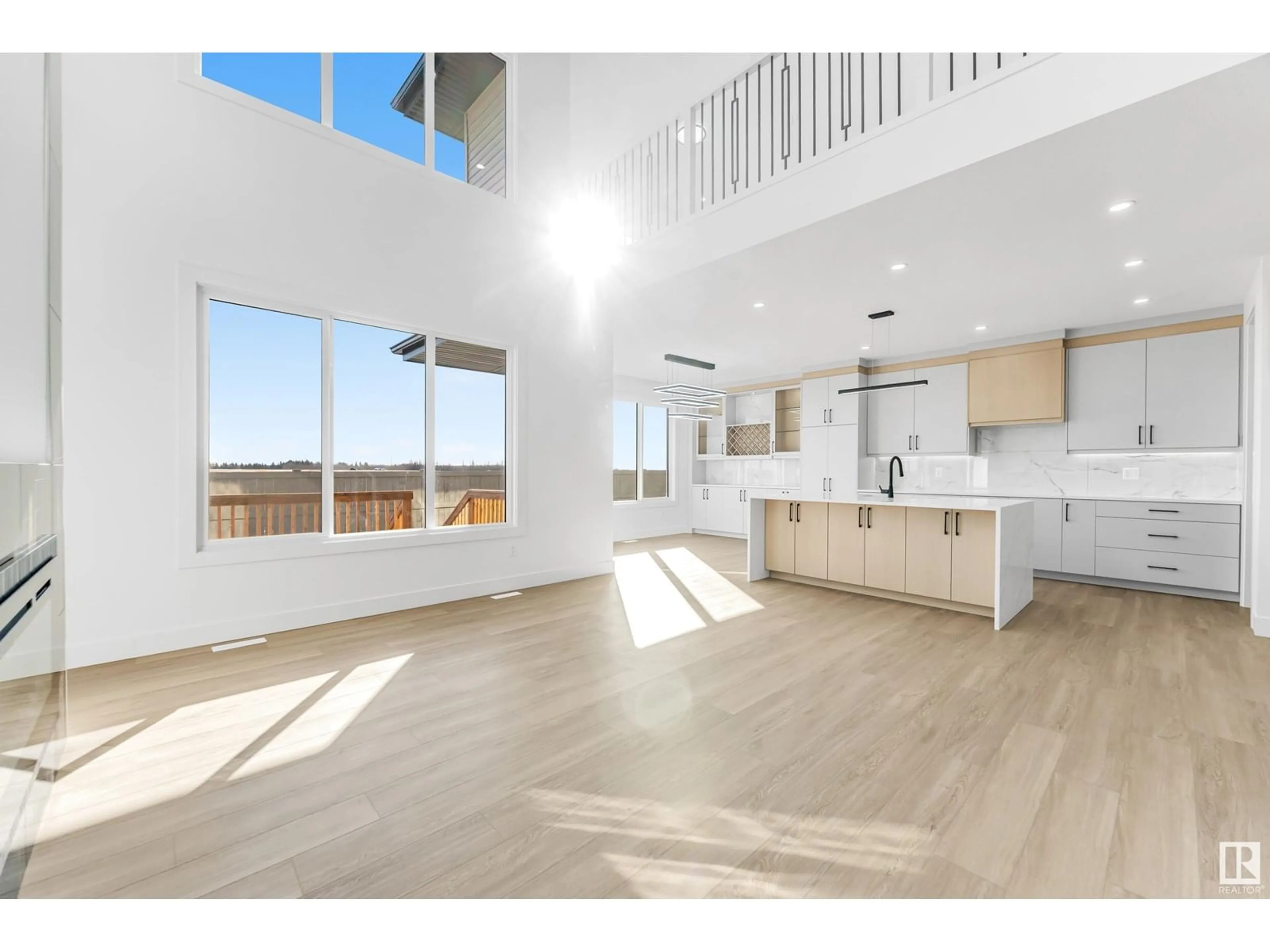 Open concept kitchen, wood/laminate floor for 9443 PEAR CR, Edmonton Alberta T6X2Z5