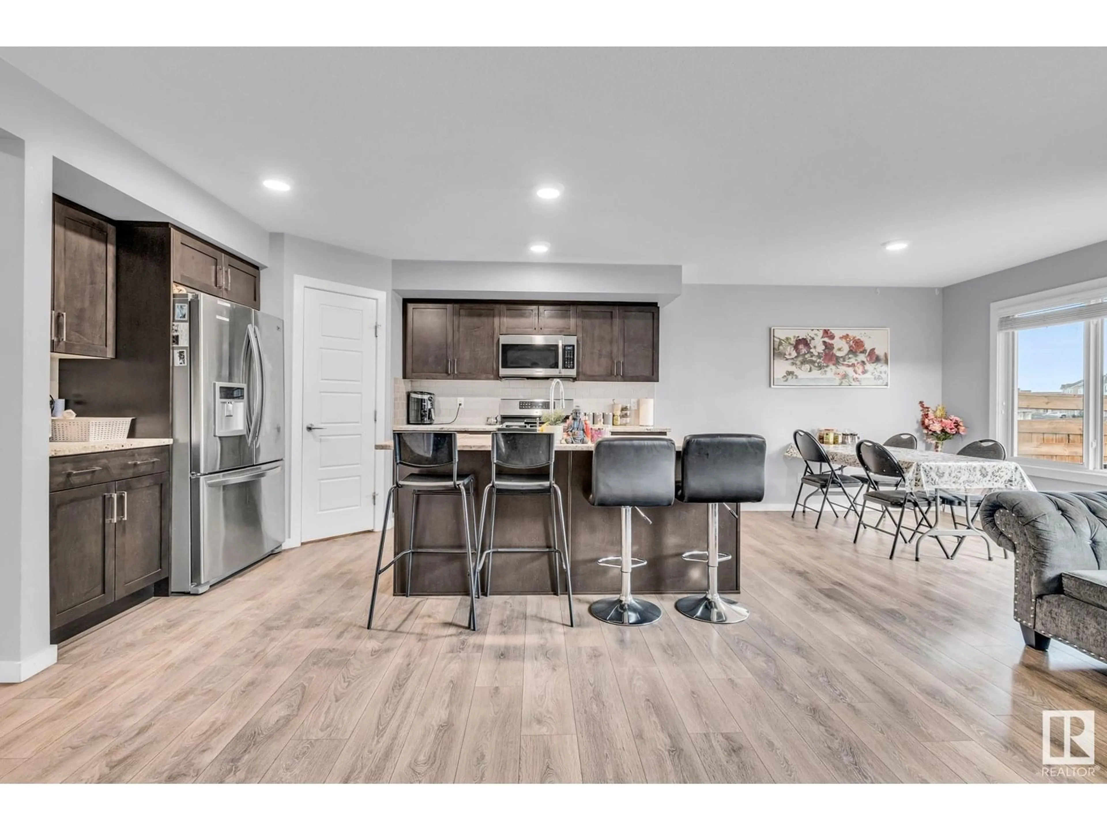 Open concept kitchen, wood/laminate floor for 1286 DANIELS CR, Edmonton Alberta T6W3J1
