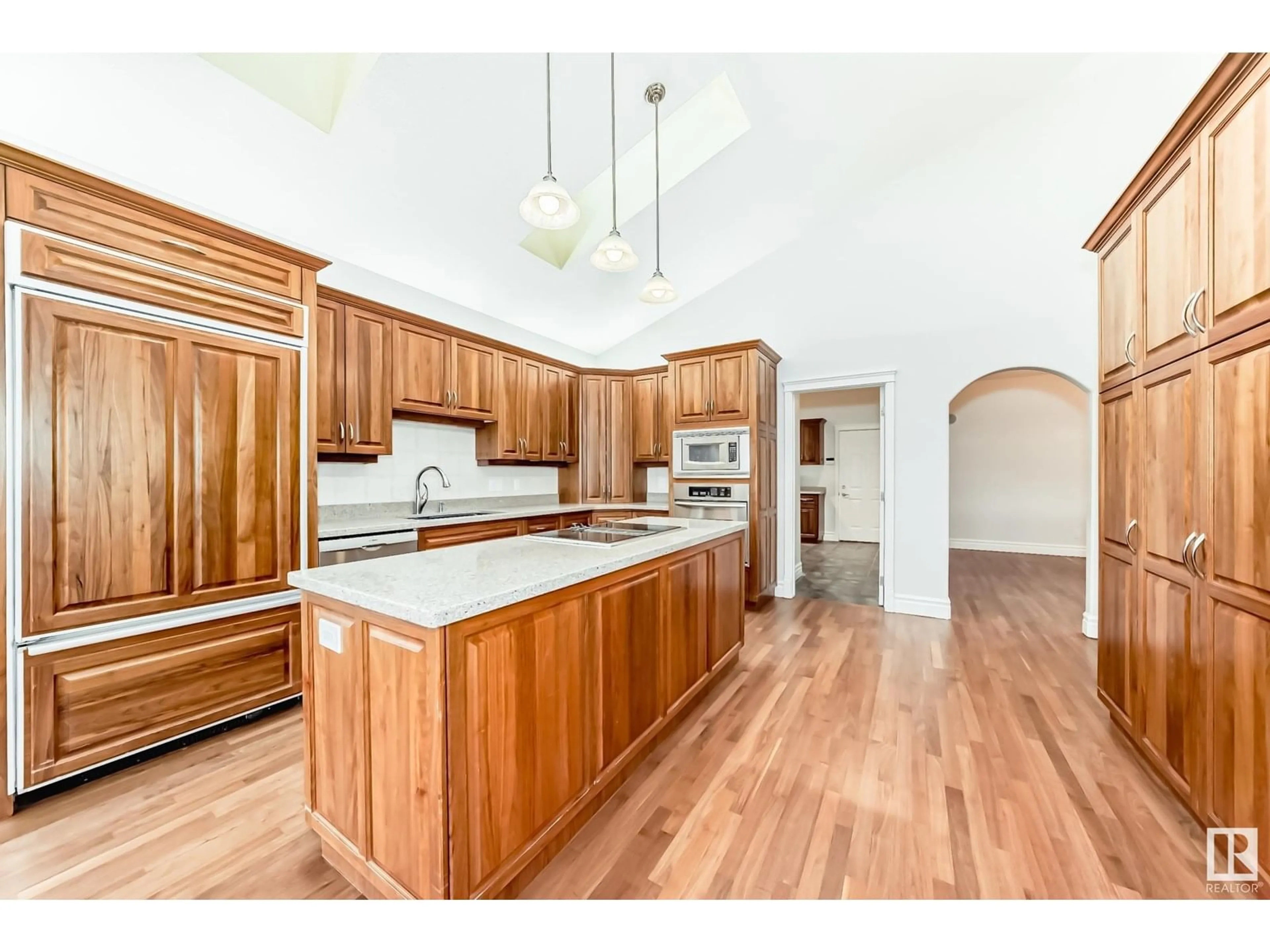 Open concept kitchen, wood/laminate floor for #435 - 52304 RGE ROAD 233, Rural Strathcona County Alberta T8B1C9