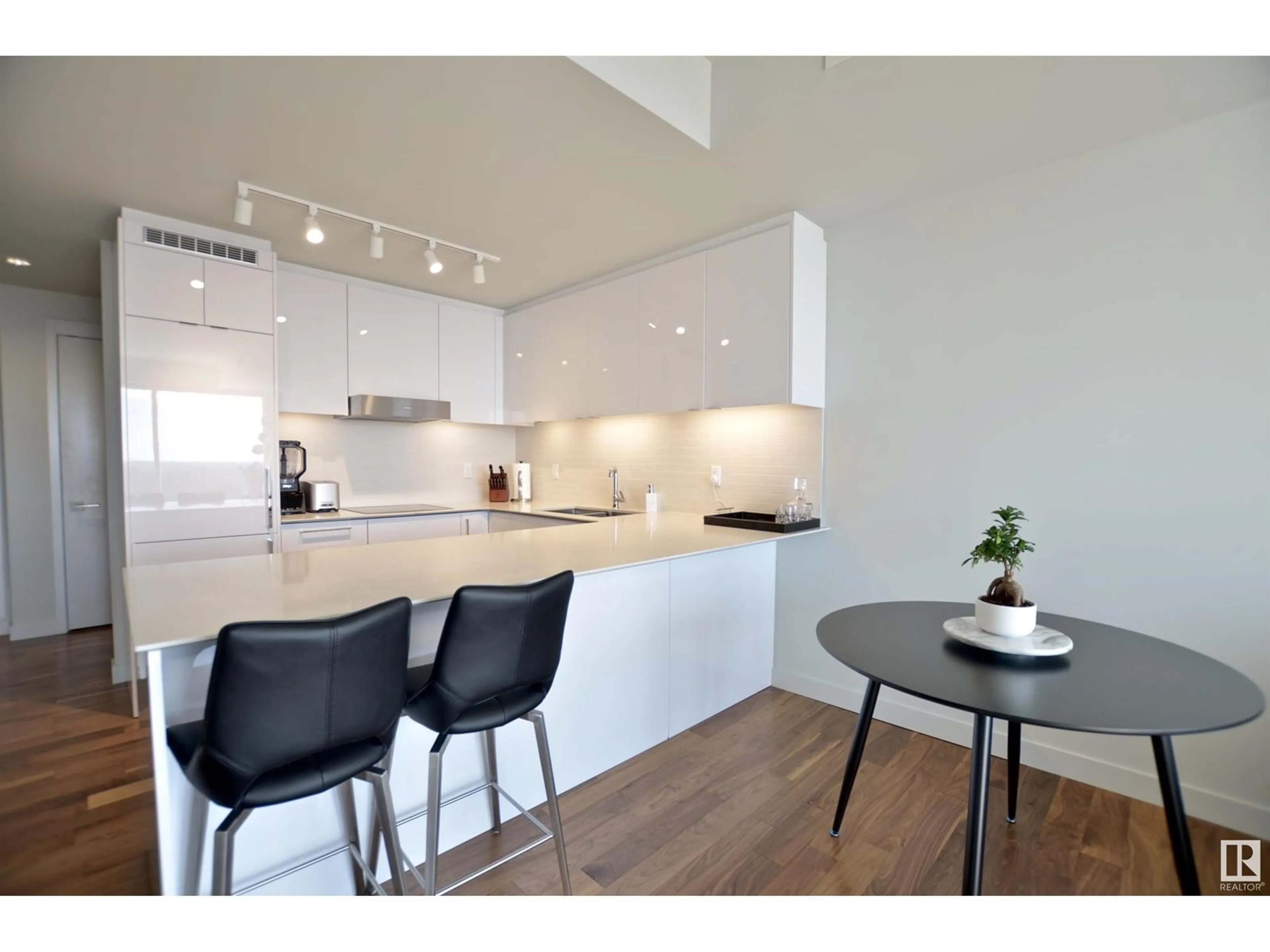 Open concept kitchen, wood/laminate floor for 10360 - 3211 102 ST NW, Edmonton Alberta T5J0K6