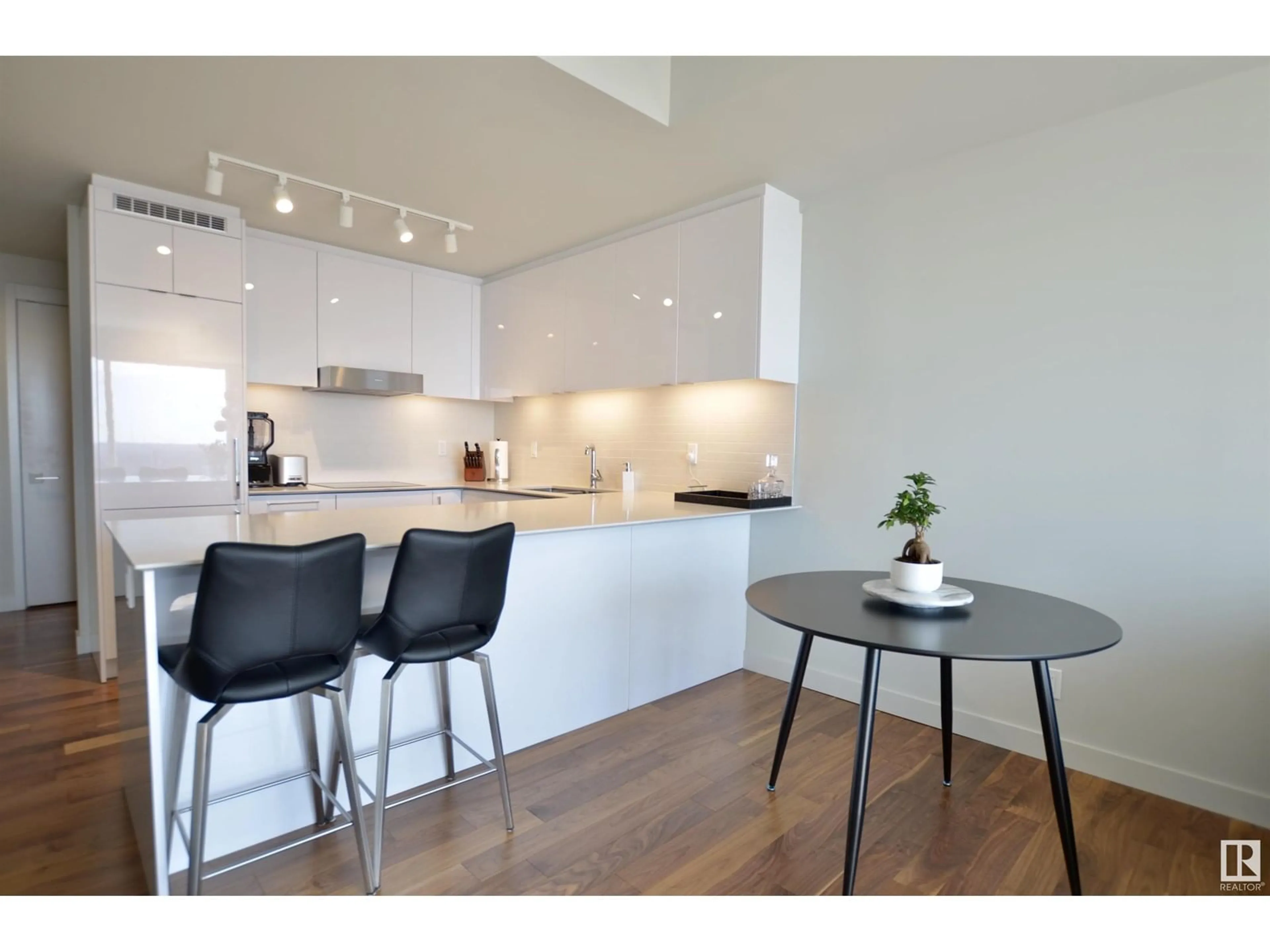 Open concept kitchen, wood/laminate floor for 10360 - 3211 102 ST NW, Edmonton Alberta T5J0K6