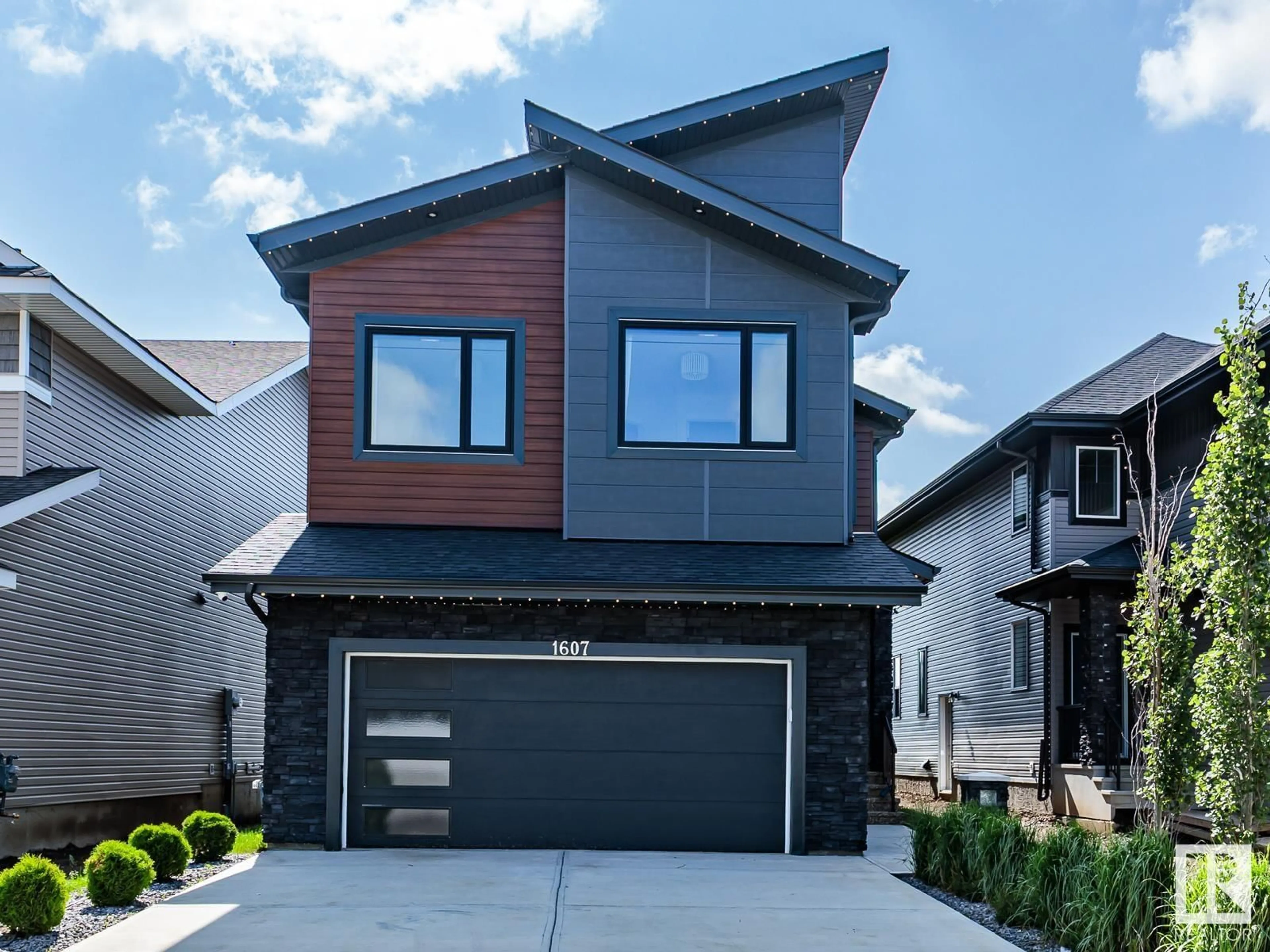 Home with vinyl exterior material, street for SW - 1607 157 ST, Edmonton Alberta T6W4J8