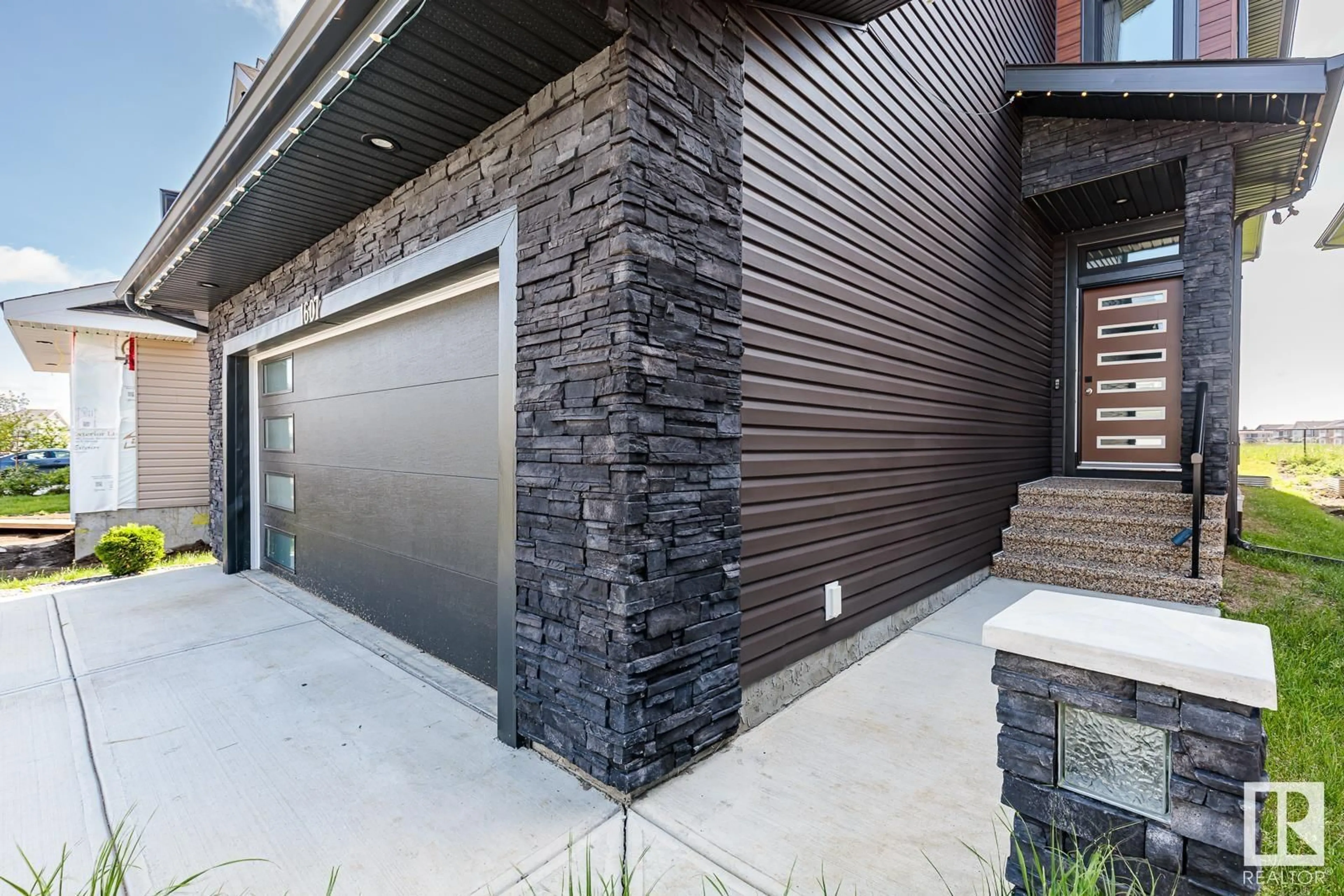 Home with brick exterior material, street for SW - 1607 157 ST, Edmonton Alberta T6W4J8