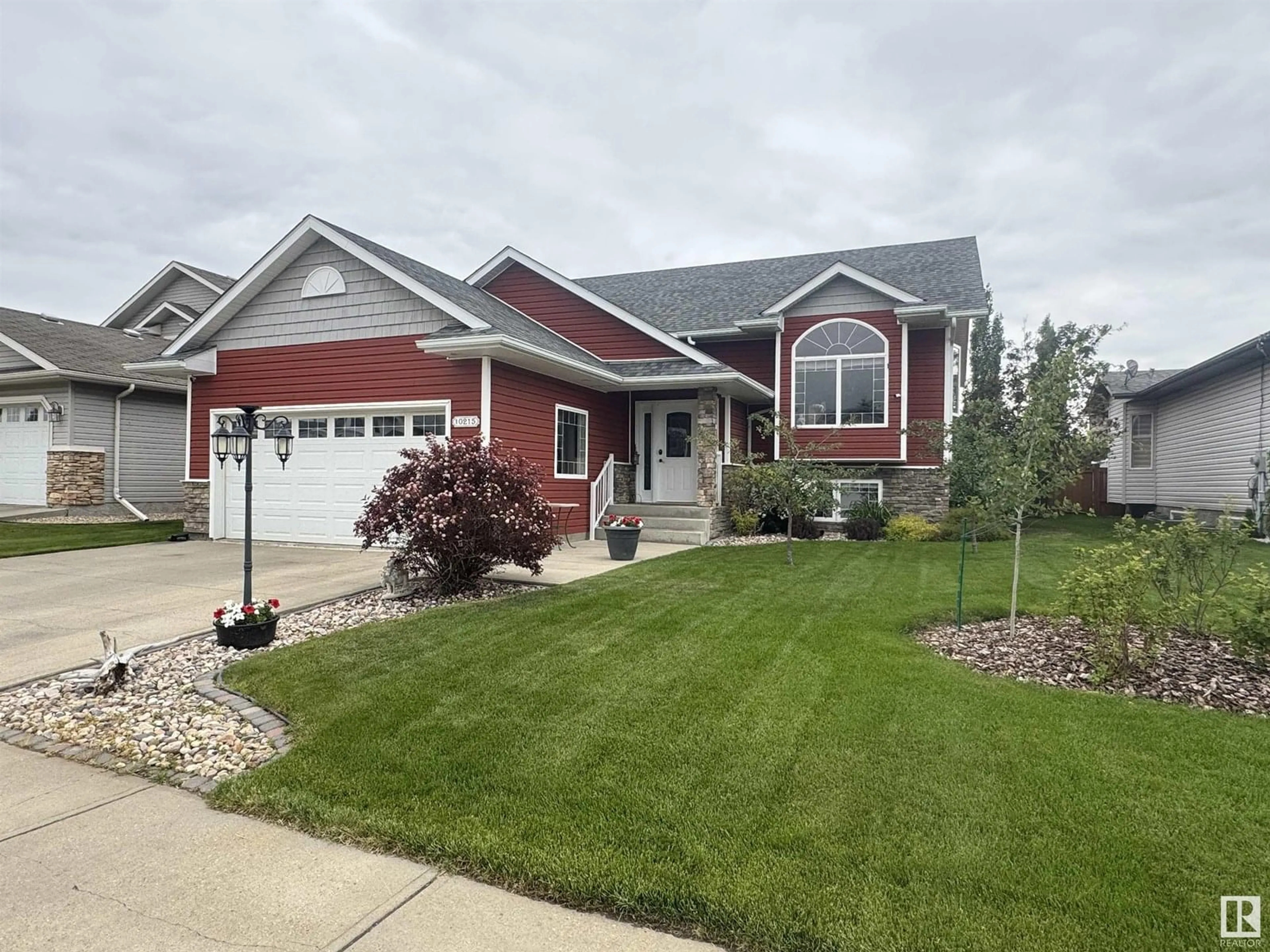 Home with vinyl exterior material, street for 10215 110 AV, Westlock Alberta T7P2S1