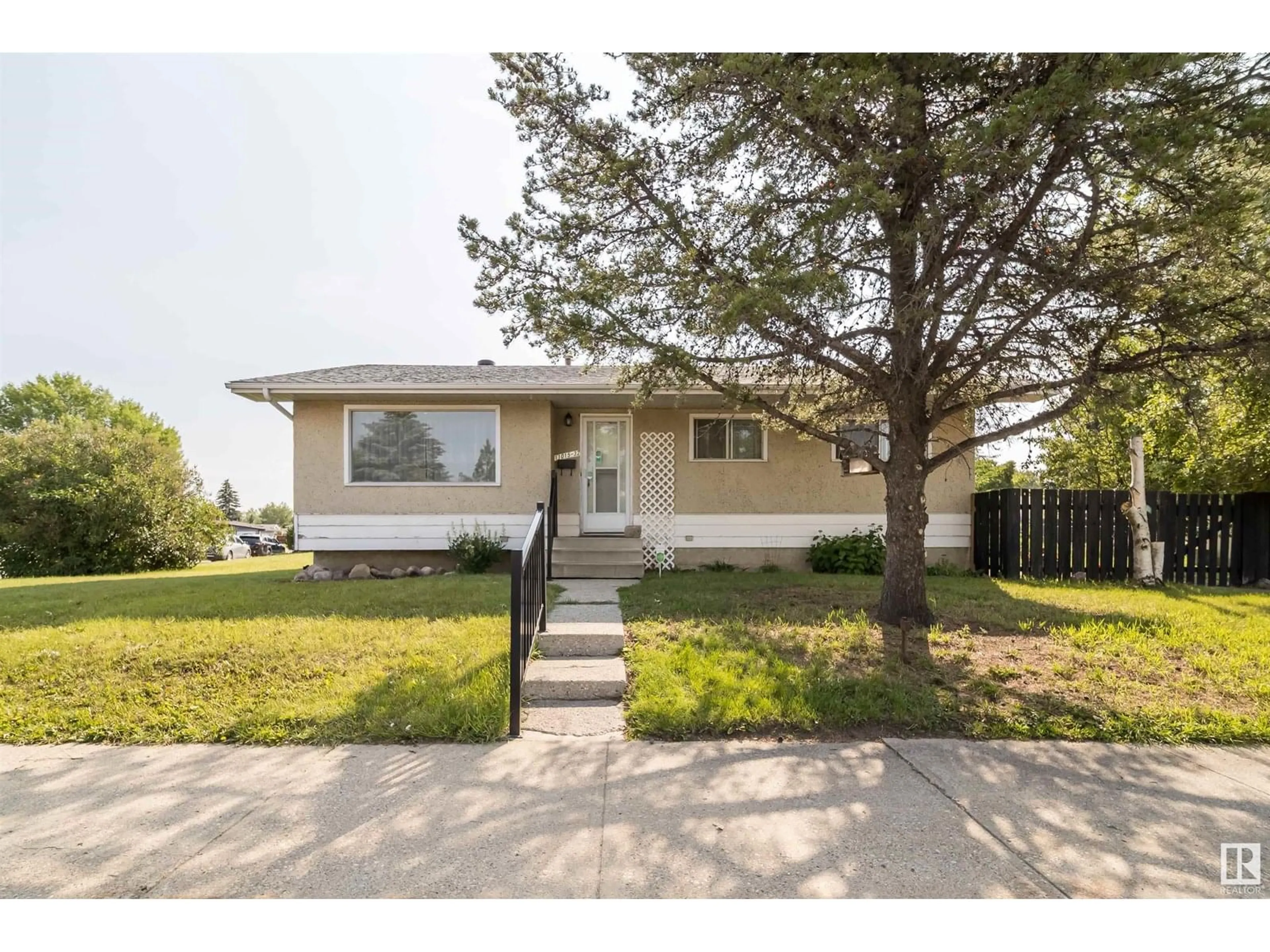 Home with vinyl exterior material, street for NW - 11015 32 ST, Edmonton Alberta T5W1X4