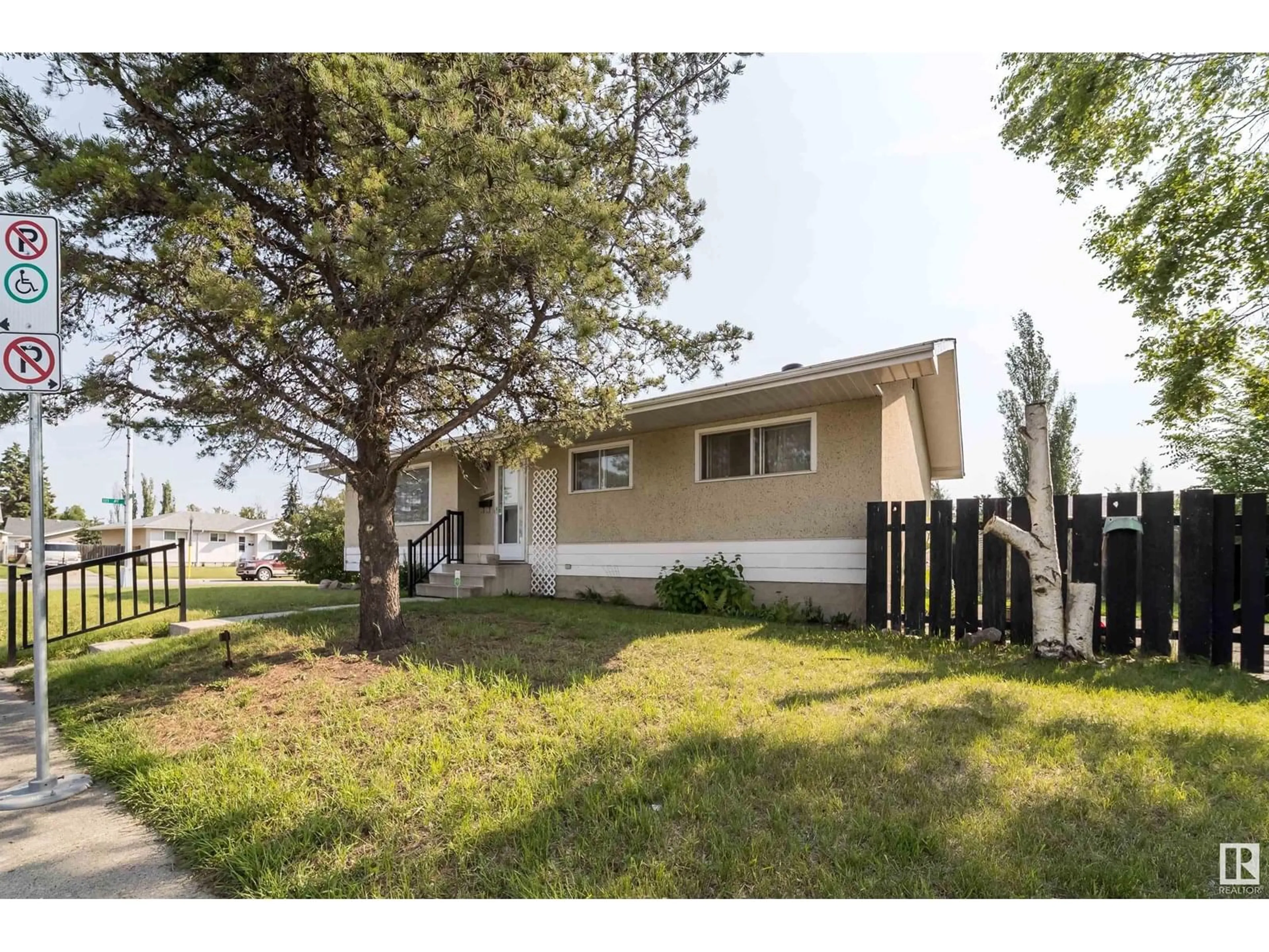 Home with vinyl exterior material, street for NW - 11015 32 ST, Edmonton Alberta T5W1X4