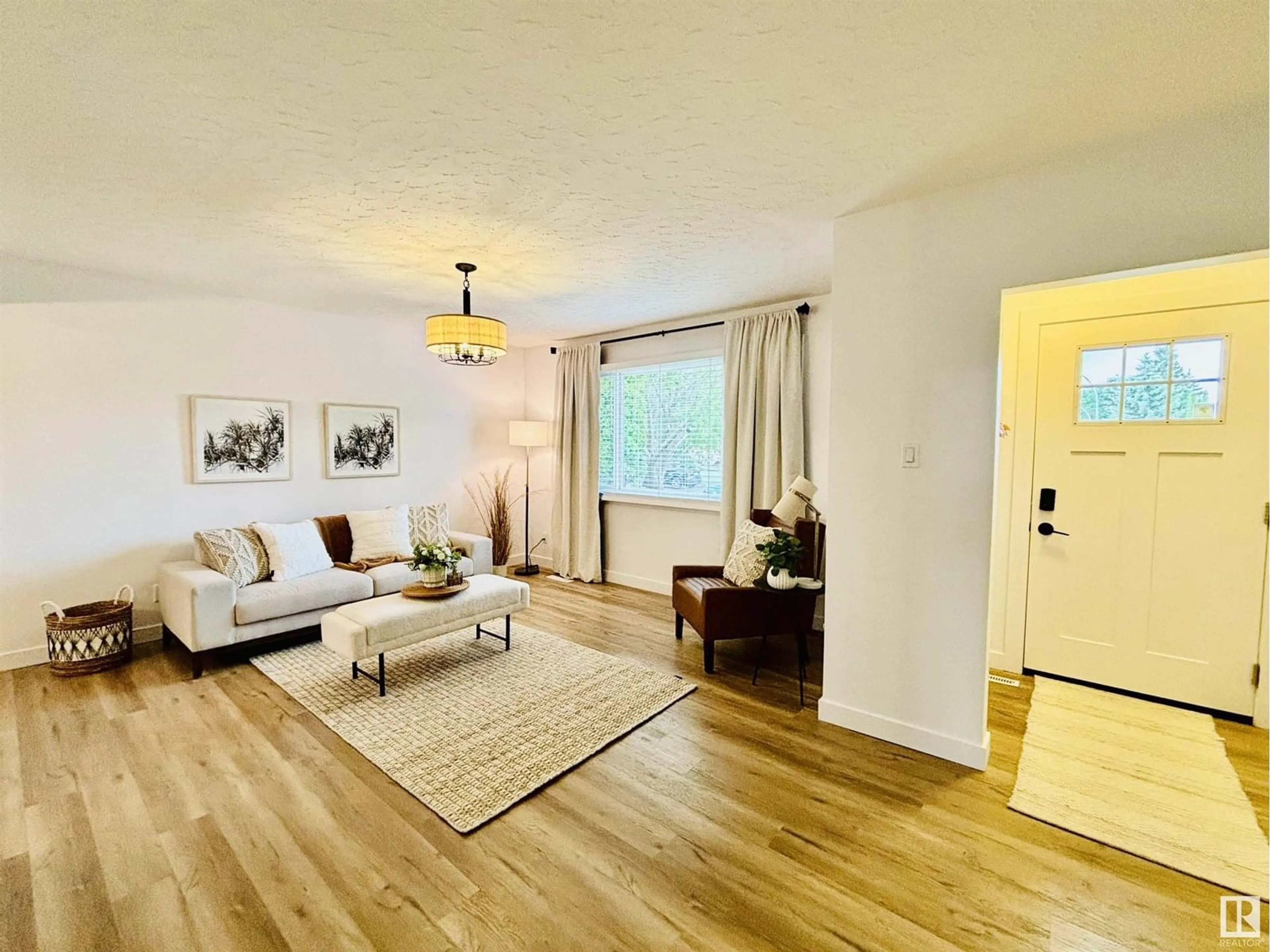 Living room with furniture, wood/laminate floor for NW - 10403 42 ST, Edmonton Alberta T6A1T3